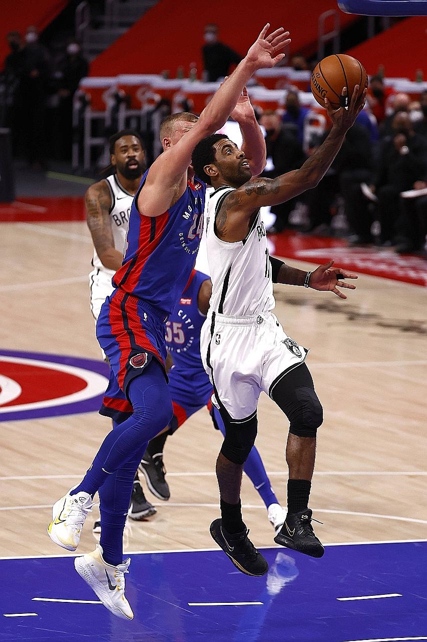 Brooklyn's Kyrie Irving driving past Detroit's Mason Plumlee at Little Caesars Arena in Michigan on Tuesday. The visitors were once more poor in defence in their shock 122-111 loss to the East's bottom side.