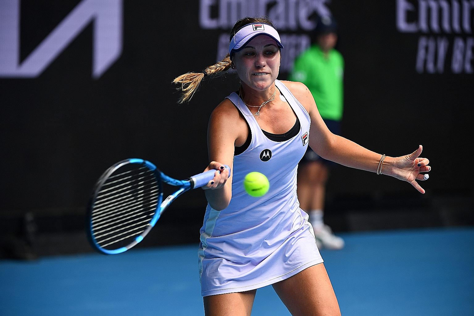American Sofia Kenin returning to 35-year-old Estonian Kaia Kanepi at the Australian Open in Melbourne yesterday. She rued having chances but not taking them.