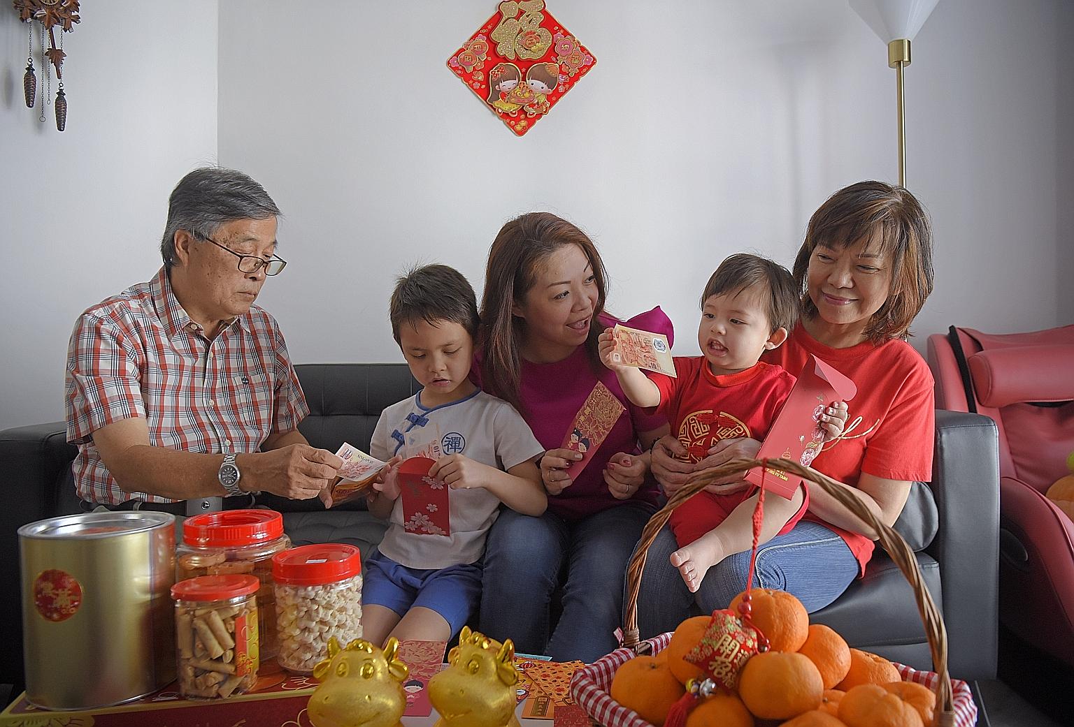 Housewife Cynthia Tan Kloth, with her sons Friedrich and Maximilian (in red), reunited with her parents - retiree Richard Tan and housewife Karen Lai - in their Punggol flat last month after spending two weeks in quarantine upon their arrival from Ge