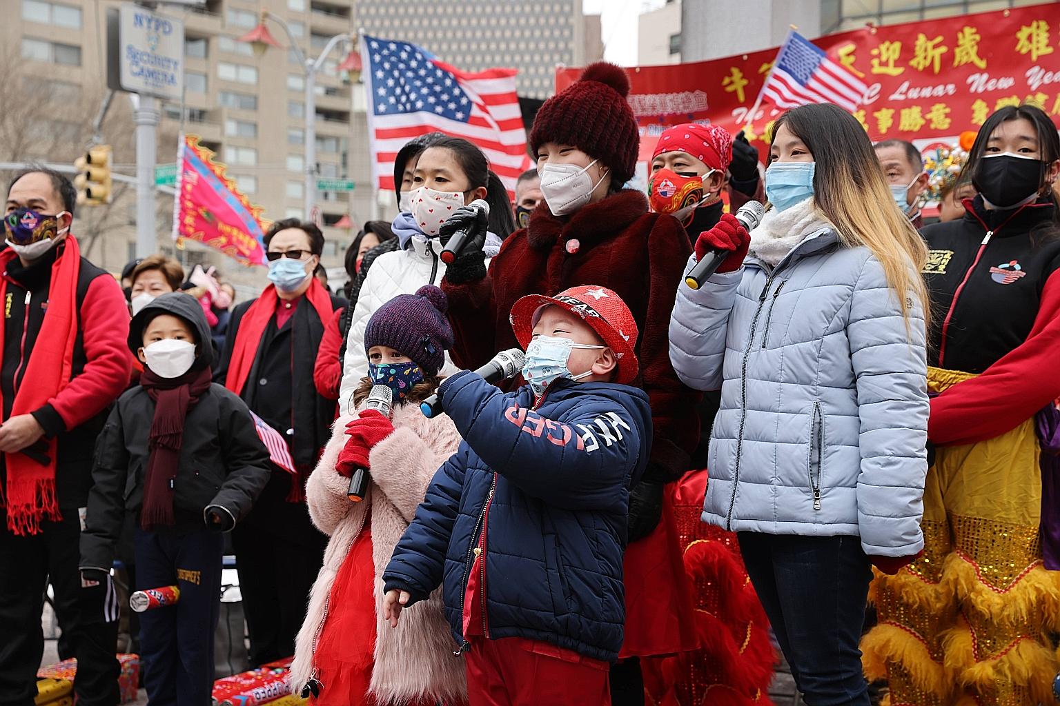 The US national anthem being sung at a Chinese New Year ceremony in New York City's Chinatown on Friday. "Racially motivated violence and other incidents against Asian Americans have reached an alarming level across the US since the outbreak of Covid