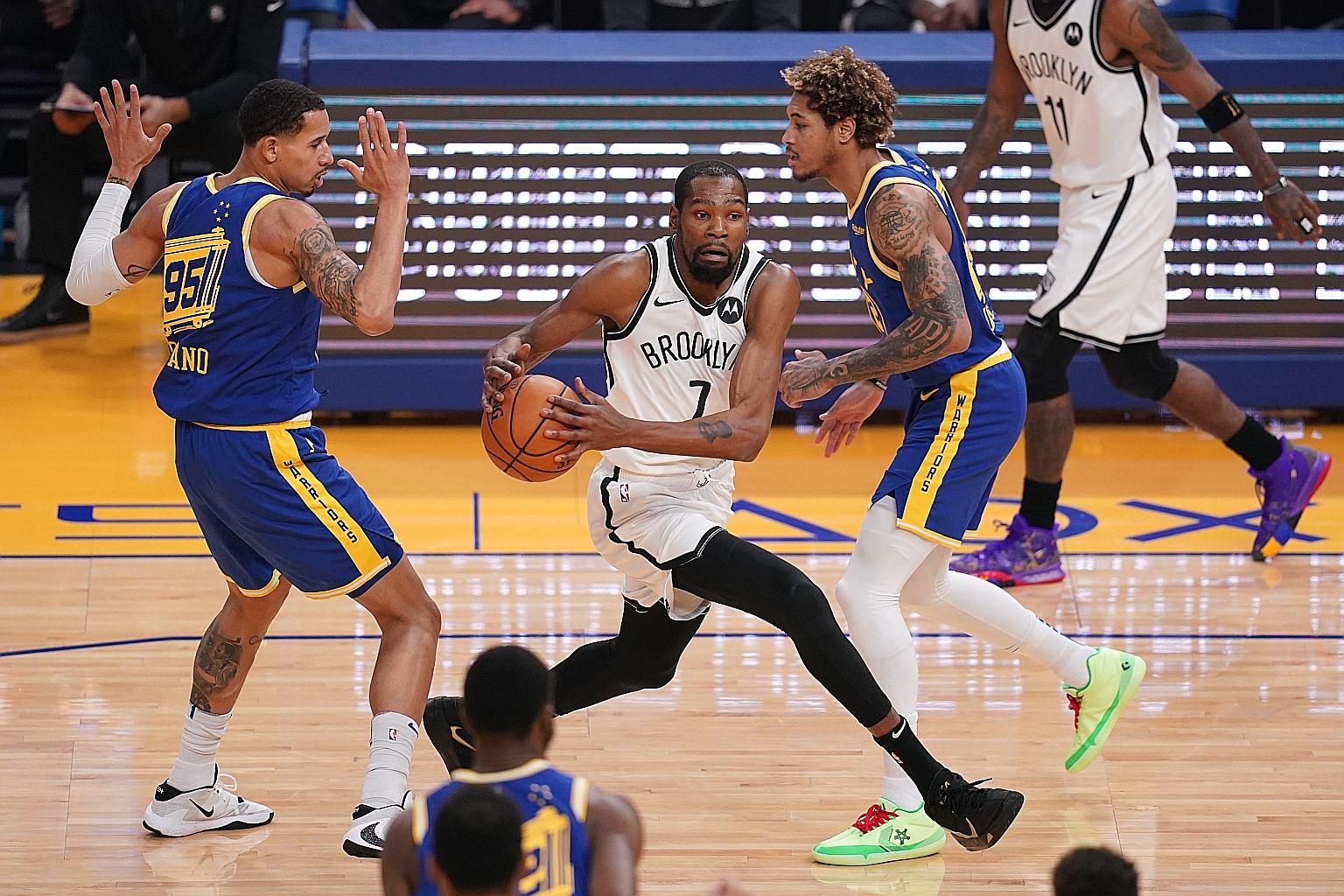 Nets forward Kevin Durant driving to the hoop against his former team Warriors at the Chase Centre in San Francisco on Saturday. He made it a point to show that there were no hard feelings, to dispel talk that he did not leave on the best terms.