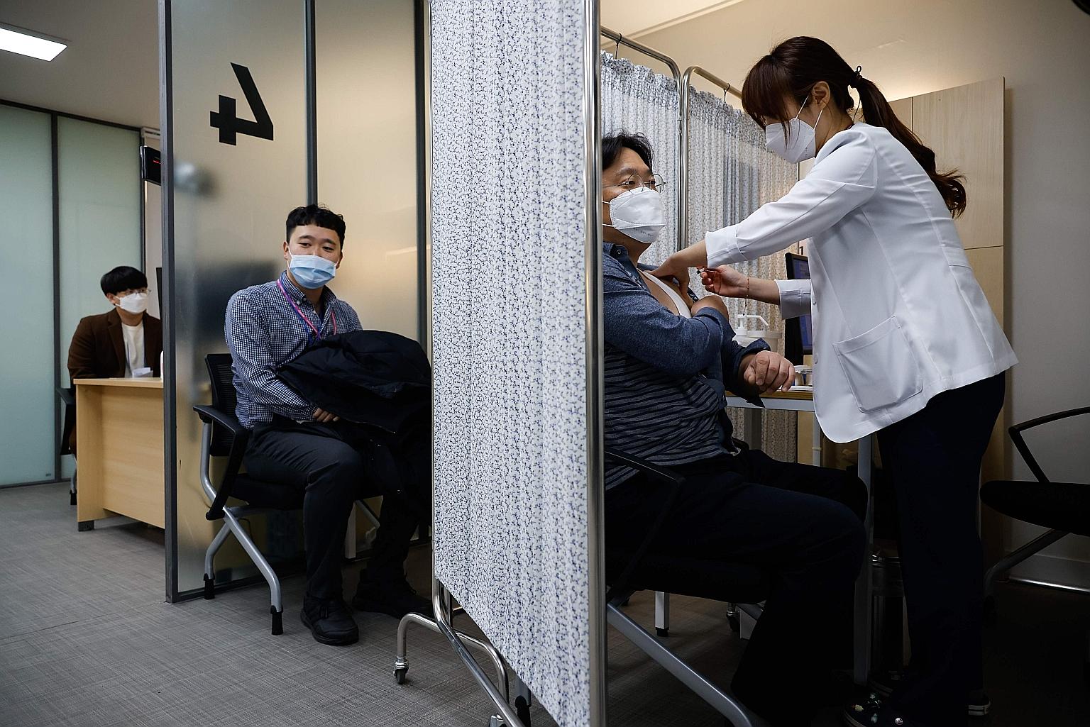 People in Seoul taking part in a mock Covid-19 coronavirus vaccination drive earlier this month.