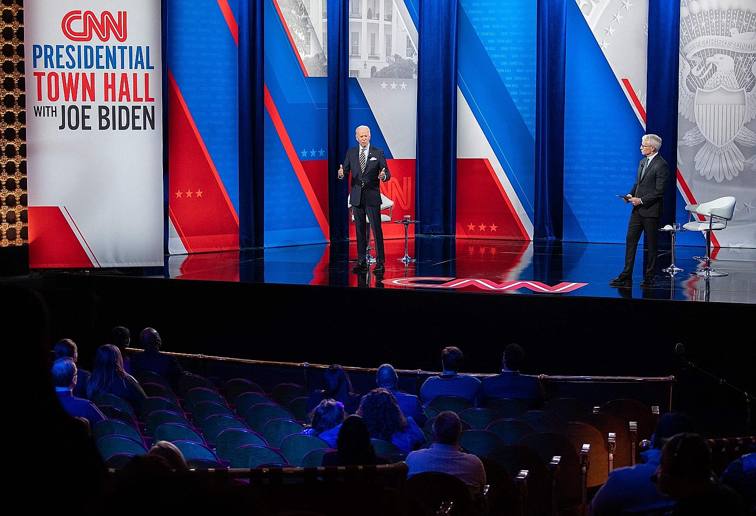 US President Joe Biden (left) at a CNN town hall hosted by anchor Anderson Cooper at the Pabst Theatre in Milwaukee, Wisconsin, on Tuesday. At the televised event, Mr Biden said the United States will reassert its global role in speaking up for human