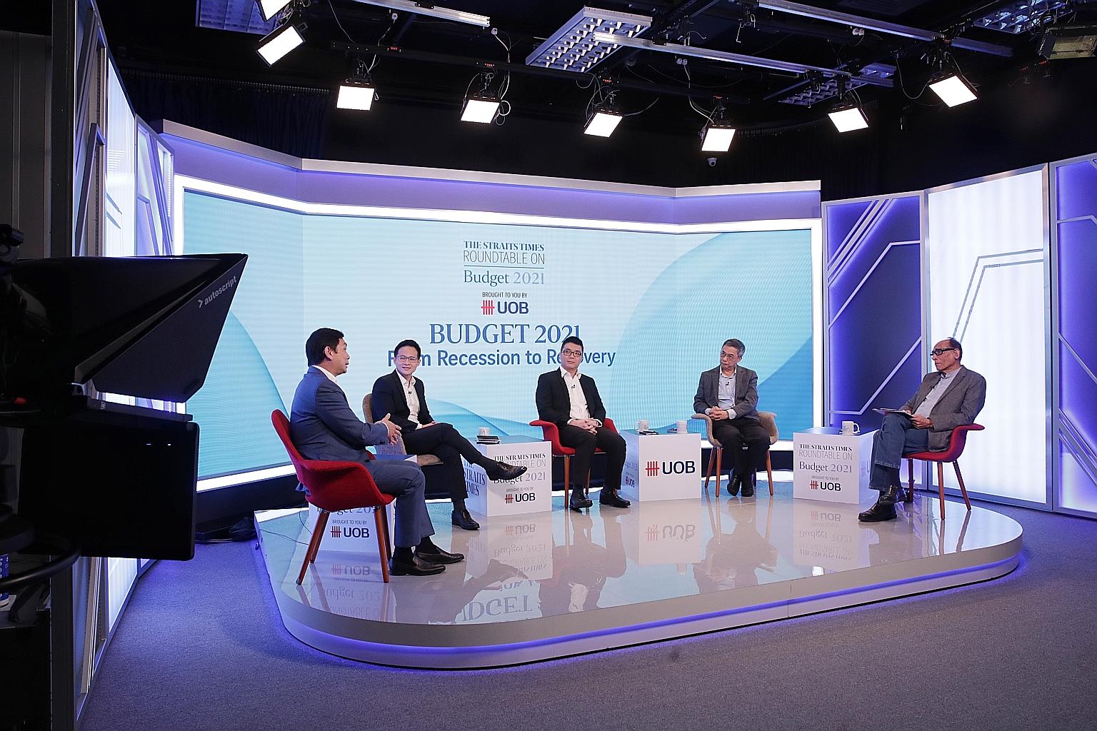 Speaking at yesterday's roundtable discussion organised by The Straits Times and UOB were (from left) Mr Douglas Foo, president of the Singapore Manufacturing Federation and vice-chairman of the Singapore Business Federation; labour MP Desmond Choo, 