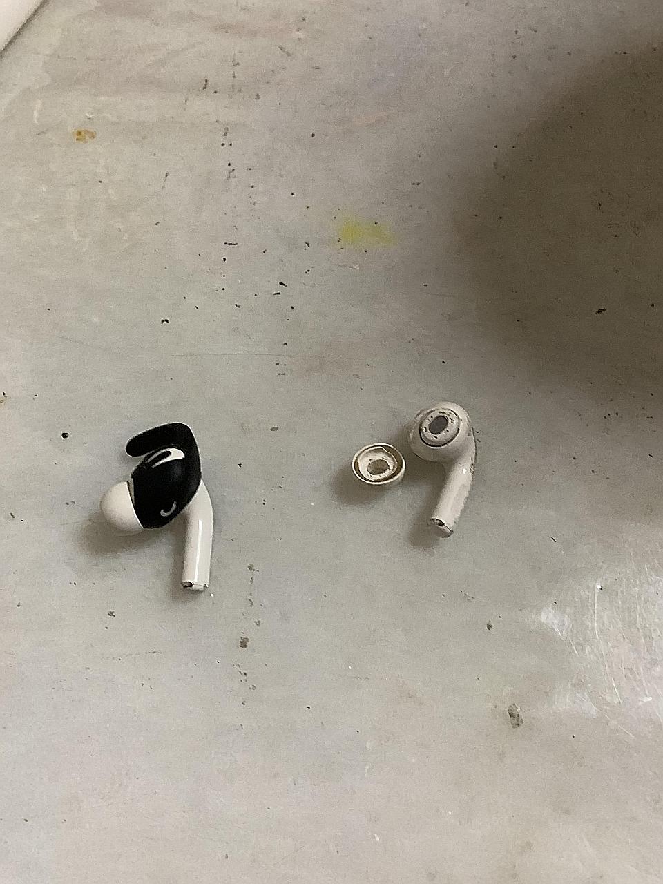 Ms Loke Xiao Li's noise-cancelling earbuds, which she wore during her run. The one on the right was damaged. ST PHOTO: WONG SHIYING