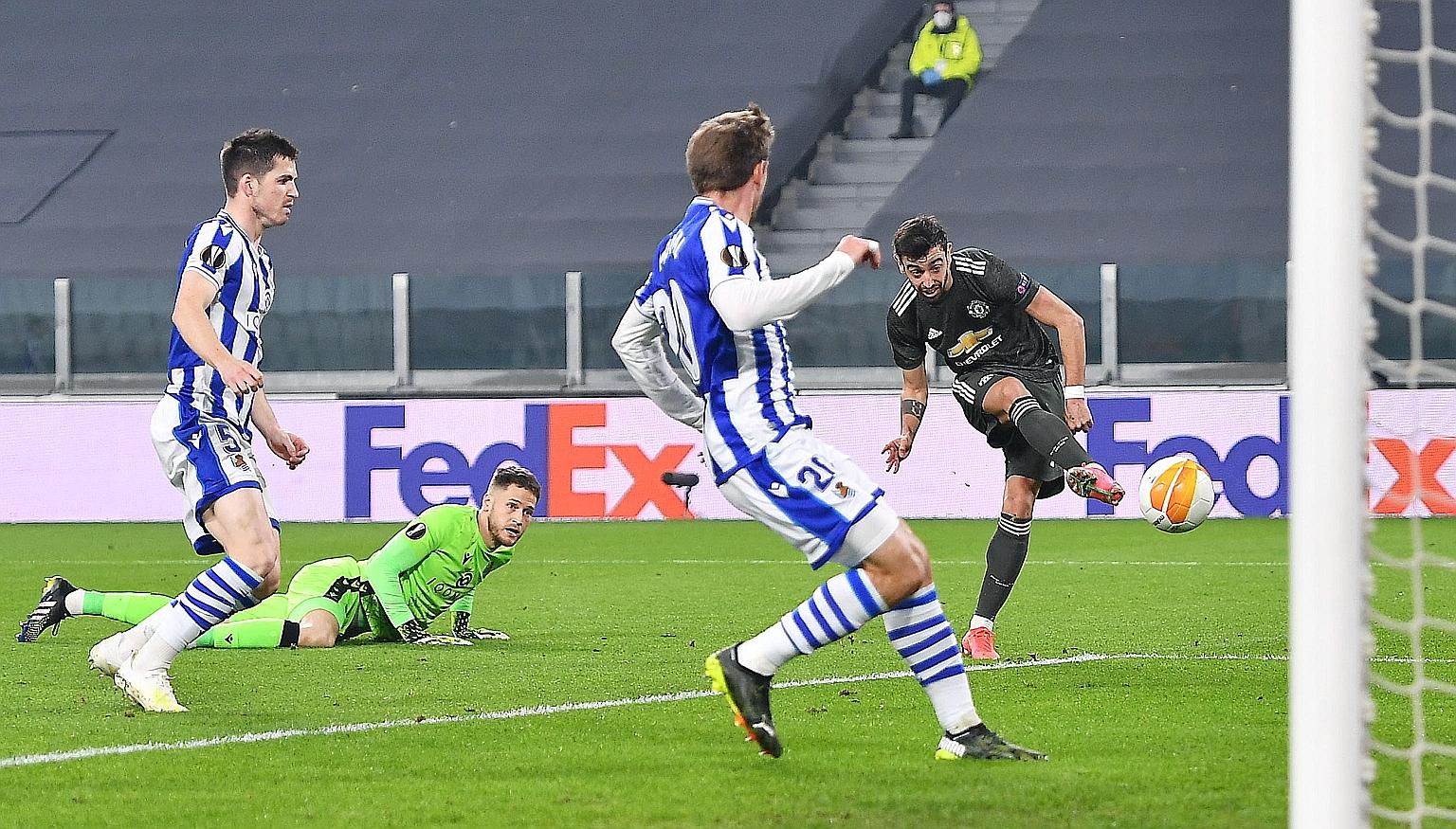 Manchester United's Bruno Fernandes scoring the opening goal in the Europa League last-32, first-leg match against Real Sociedad at the Allianz Stadium in Turin, Italy.
