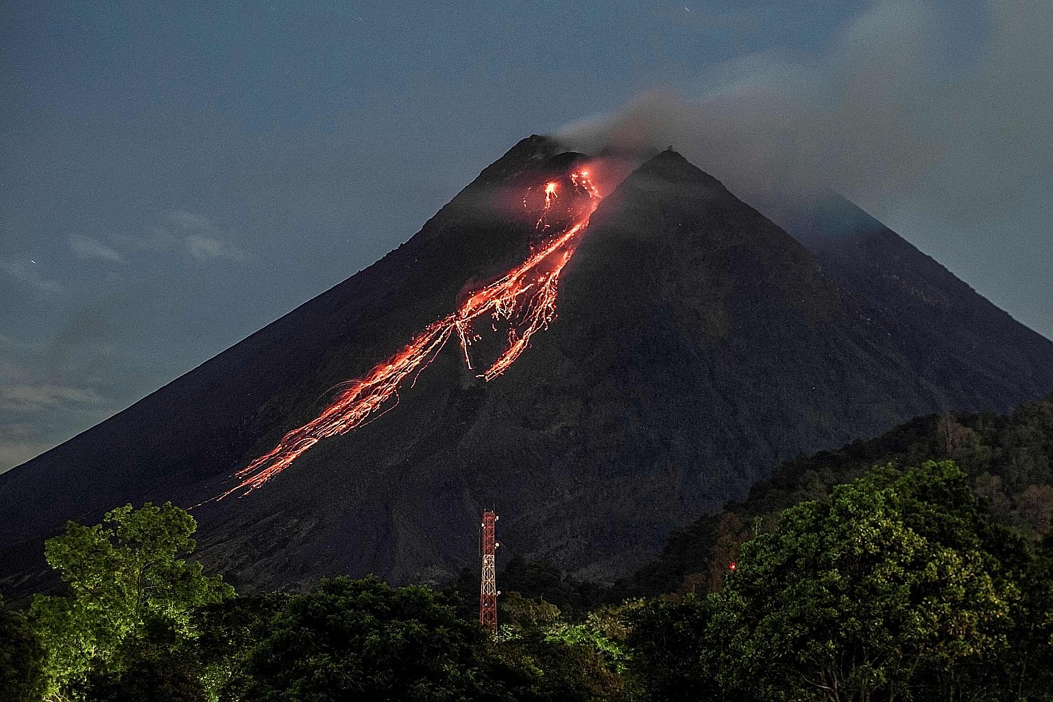 Red-hot lava flowing down from the crater of Mount Merapi as seen from Kaliurang, in Yogyakarta, yesterday. Residents near the volcano, which has been erupting sporadically since January, have been warned to avoid the area within a 5km radius of the