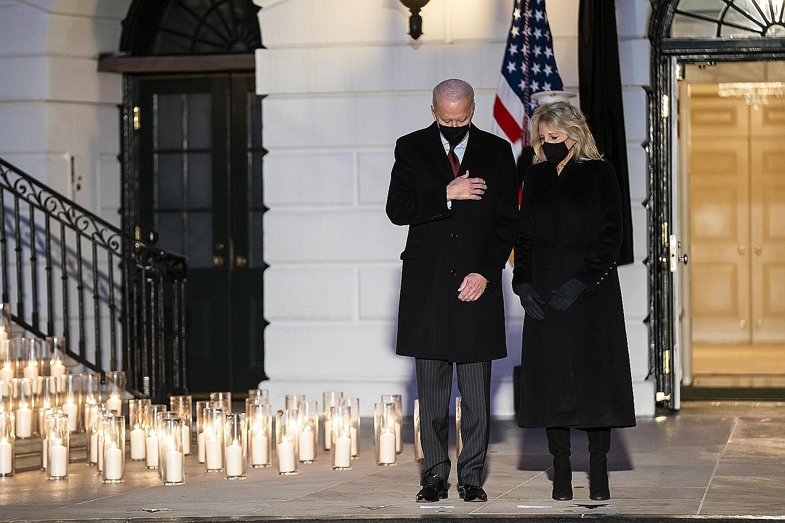US President Joe Biden and First Lady Jill Biden observing a moment of silence on Monday, at a White House ceremony to mourn the more than 500,000 lives lost to Covid-19 in the country.