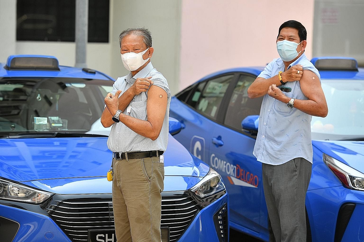 More than 50,000 active taxi and private-hire car drivers will be offered the chance to get their first dose of the Covid-19 vaccine by the end of this week. About 300 drivers, including cabbies Tham Yuet Kok (right) and Tan Eng Chuan (far right), ha
