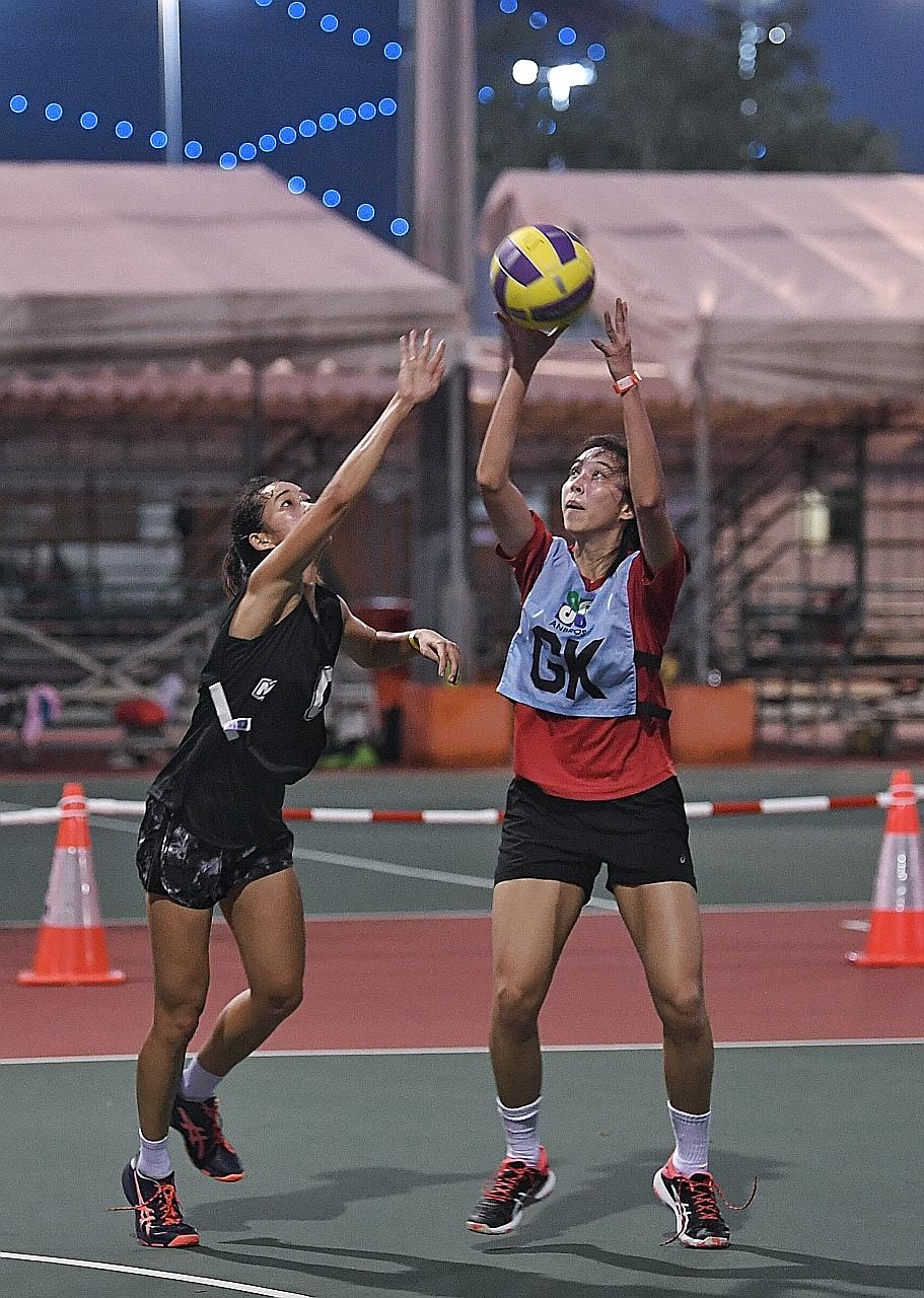 Mission Mannas goalkeeper Miki Ng taking a shot at the opposite end of the court, as Marlins Air's Tan Yi Jie defended on the first day of the 3v3 National League. Both found fulfilling multiple roles intense but were nevertheless glad to be back in 