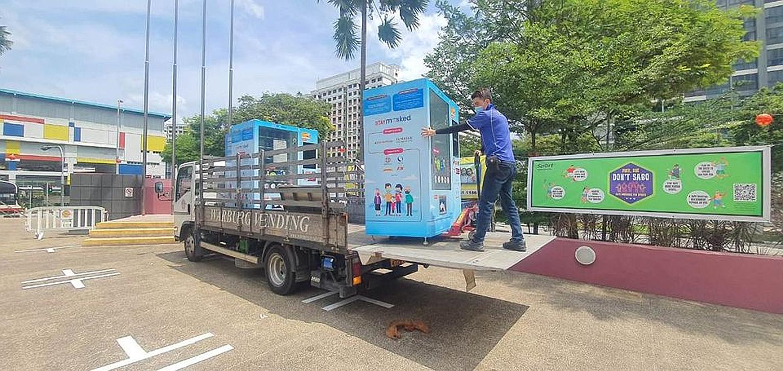 Temasek CEO Ho Ching said in a Facebook post that mask vending machines at 20 community centres have been moved to adjacent HDB blocks as the centres are being used for the roll-out of vaccinations. PHOTO: HO CHING/FACEBOOK
