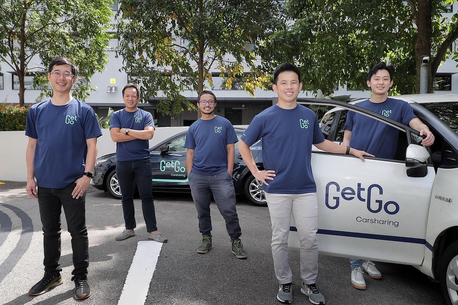 From left: GetGo general manager Chan Jun Kai, senior adviser Jeremy Ong, technical product lead Malik Badaruddin, managing director Toh Ting Feng and marketing head Johnson Lim with some of their cars at their office in Toa Payoh West. ST PHOTO: GAV
