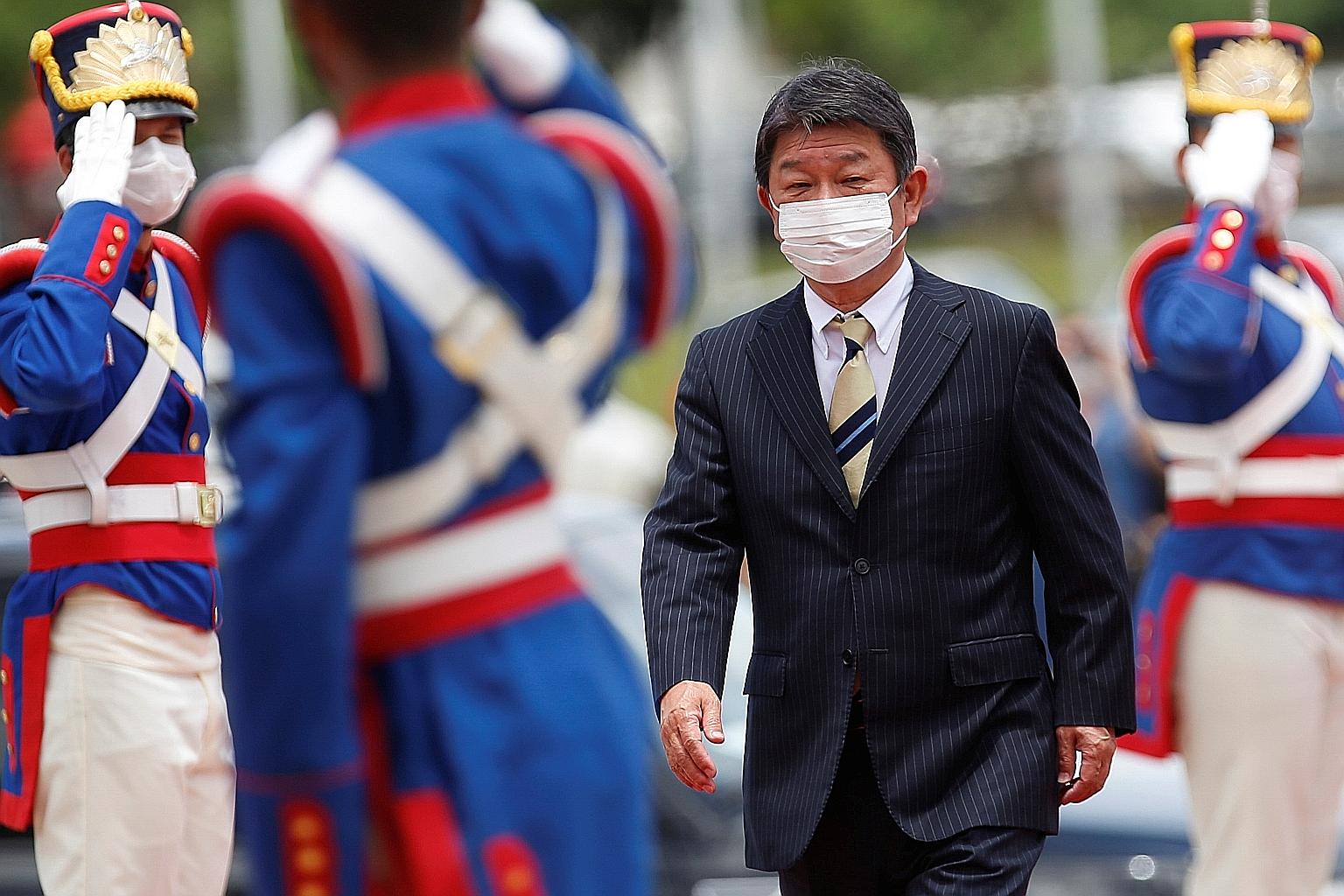 Japan's Foreign Minister Toshimitsu Motegi arriving for a meeting with his Brazilian counterpart in Brasilia last month. Mr Motegi said yesterday: "It will be dangerous if someone takes advantage of the Covid-19 crisis to justify the already existing
