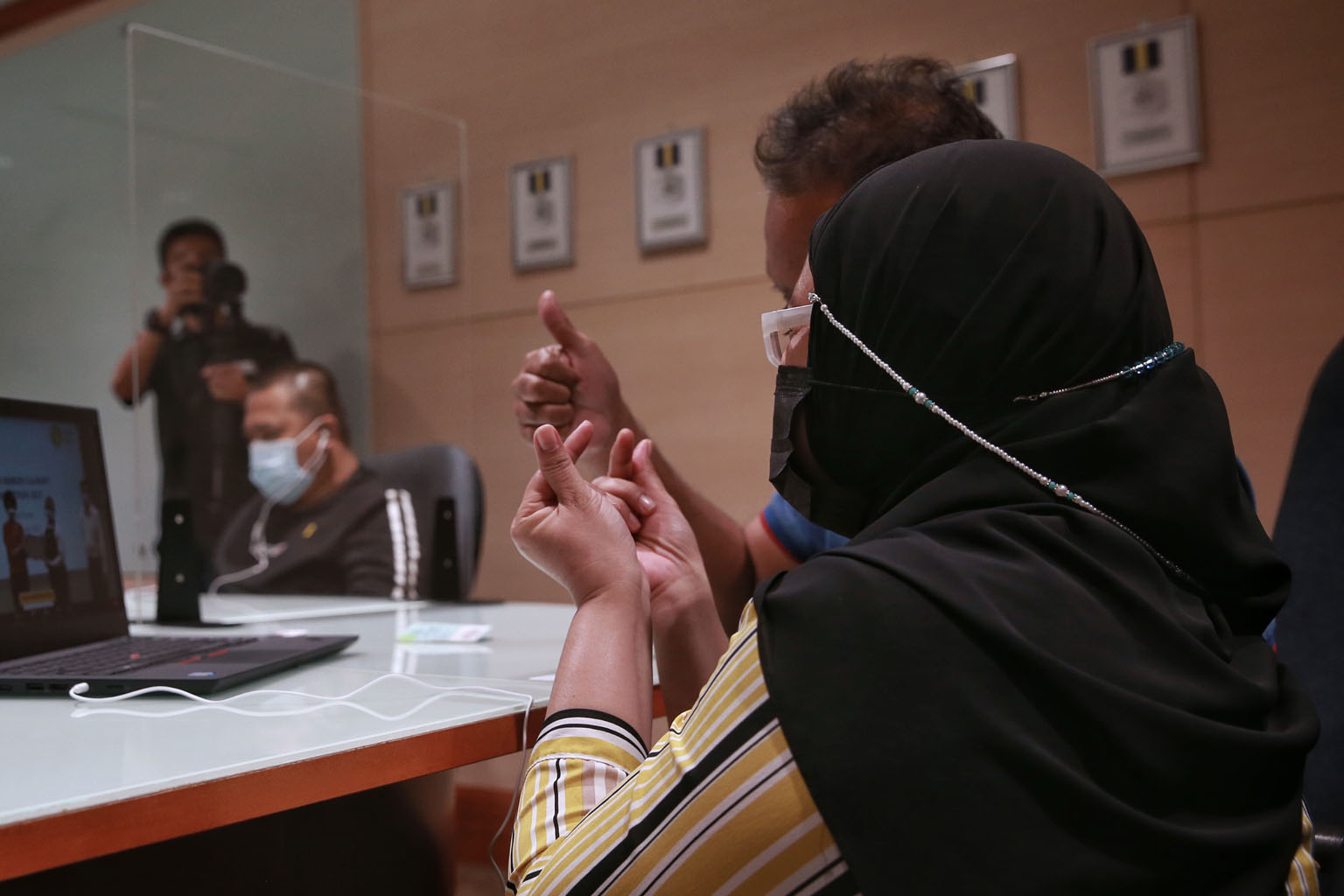 Prison inmate Adam (not his real name), 23, and his mother Marie (not her real name), 51, reacting when the dish Adam made for his mum bagged the fourth prize in the annual Yellow Ribbon Culinary Competition. ST PHOTO: KEVIN LIM