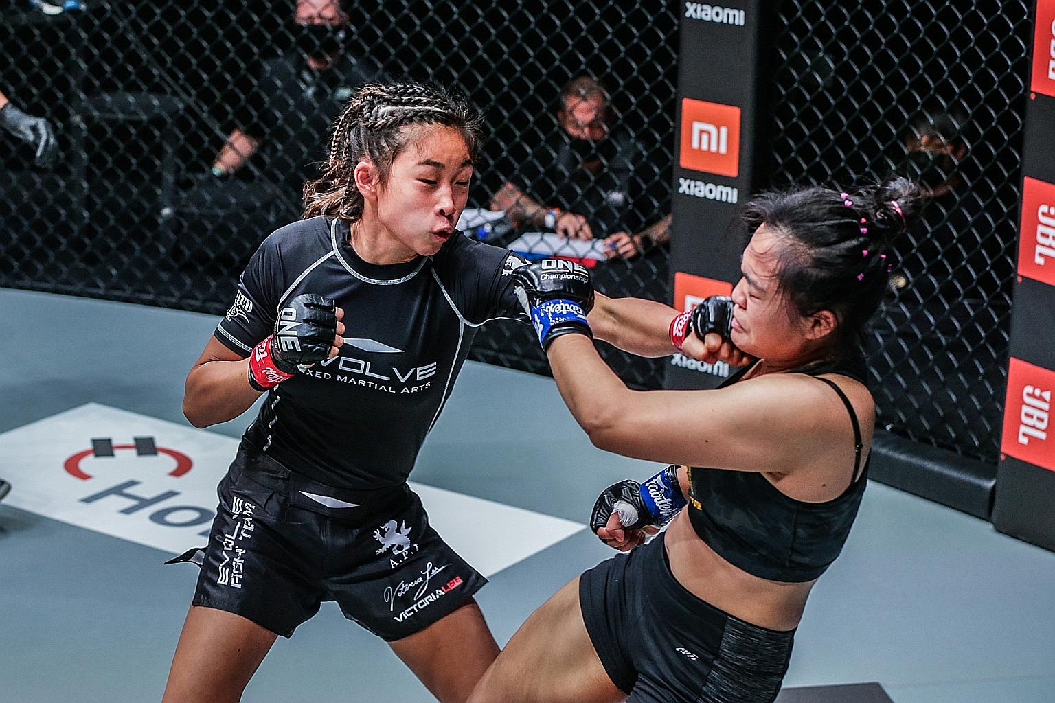 Victoria Lee, 16, younger sister of world champion Angela, landing a punch against Sunisa Srisen. Victoria would eventually choke out her Thai opponent to win by submission on her One Championship debut last night.