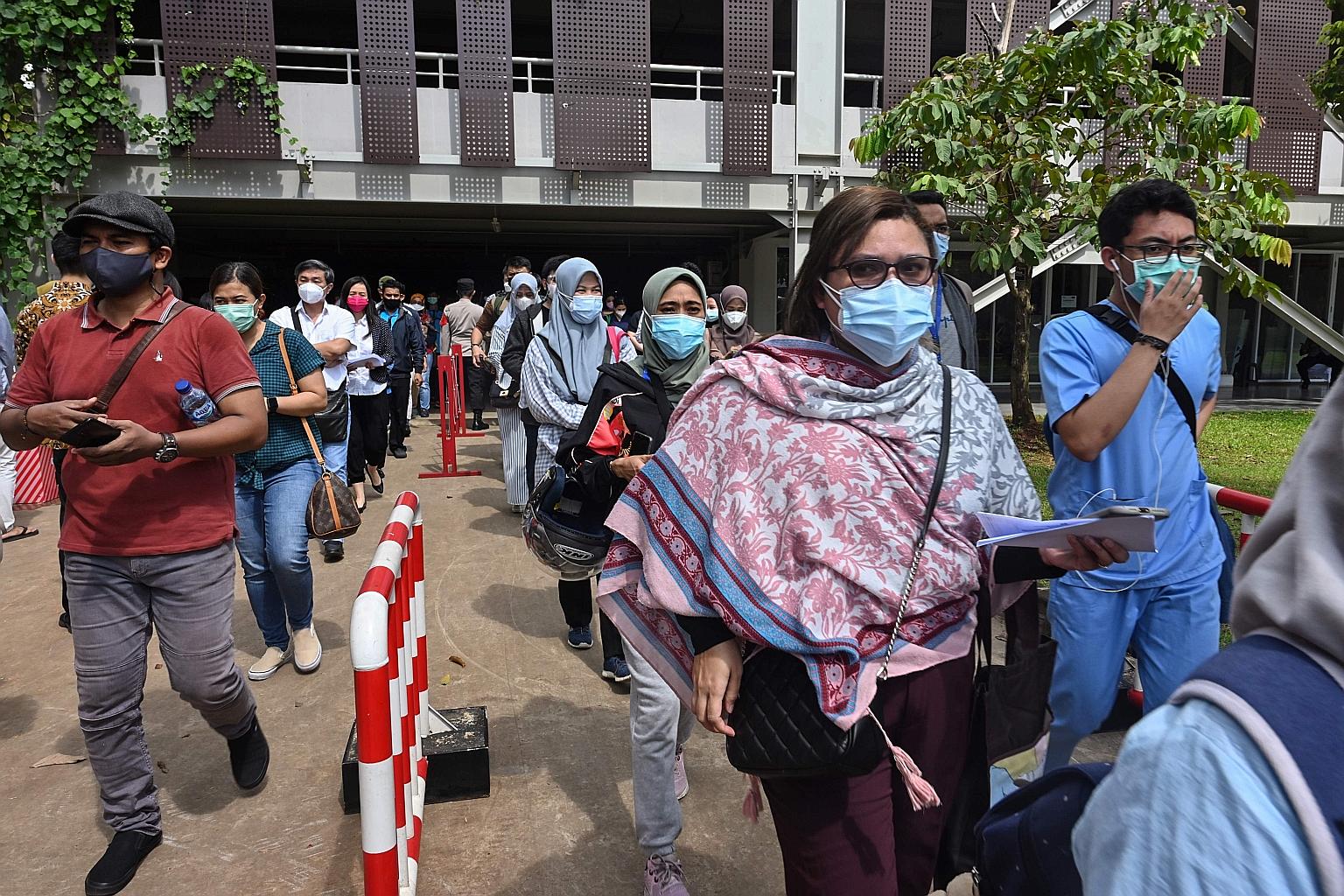 Health workers queueing for the vaccine at a sports stadium in Jakarta earlier this month. Controversy has dogged the vaccination drive, with long queues and limited supplies of the vaccine.
