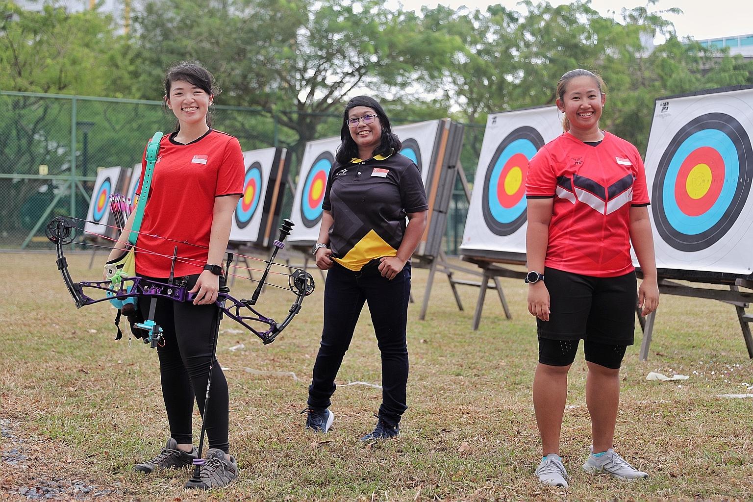 National archers (from far left) Contessa Loh, Nur Syahidah Alim and Madeleine Ong at the National Archery Range Open House yesterday. PHOTO: GAVIN FOO