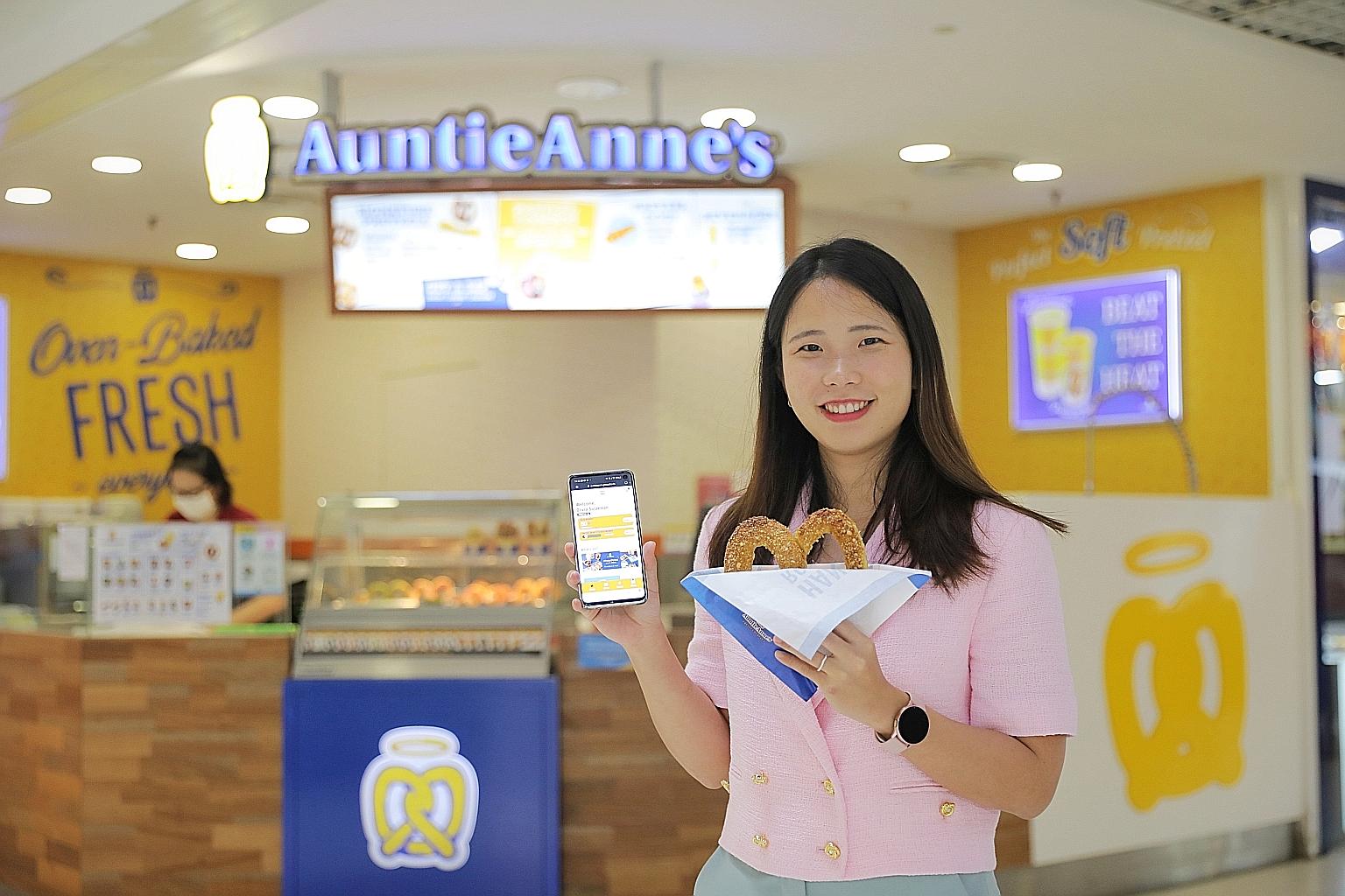 A digital consultant helped Ms Olivia Sulaeman, chief executive of the company running the Auntie Anne's outlets, to identify and implement suitable digital solutions to automate her payroll and claims processing system, among others. ST PHOTO: ONG W