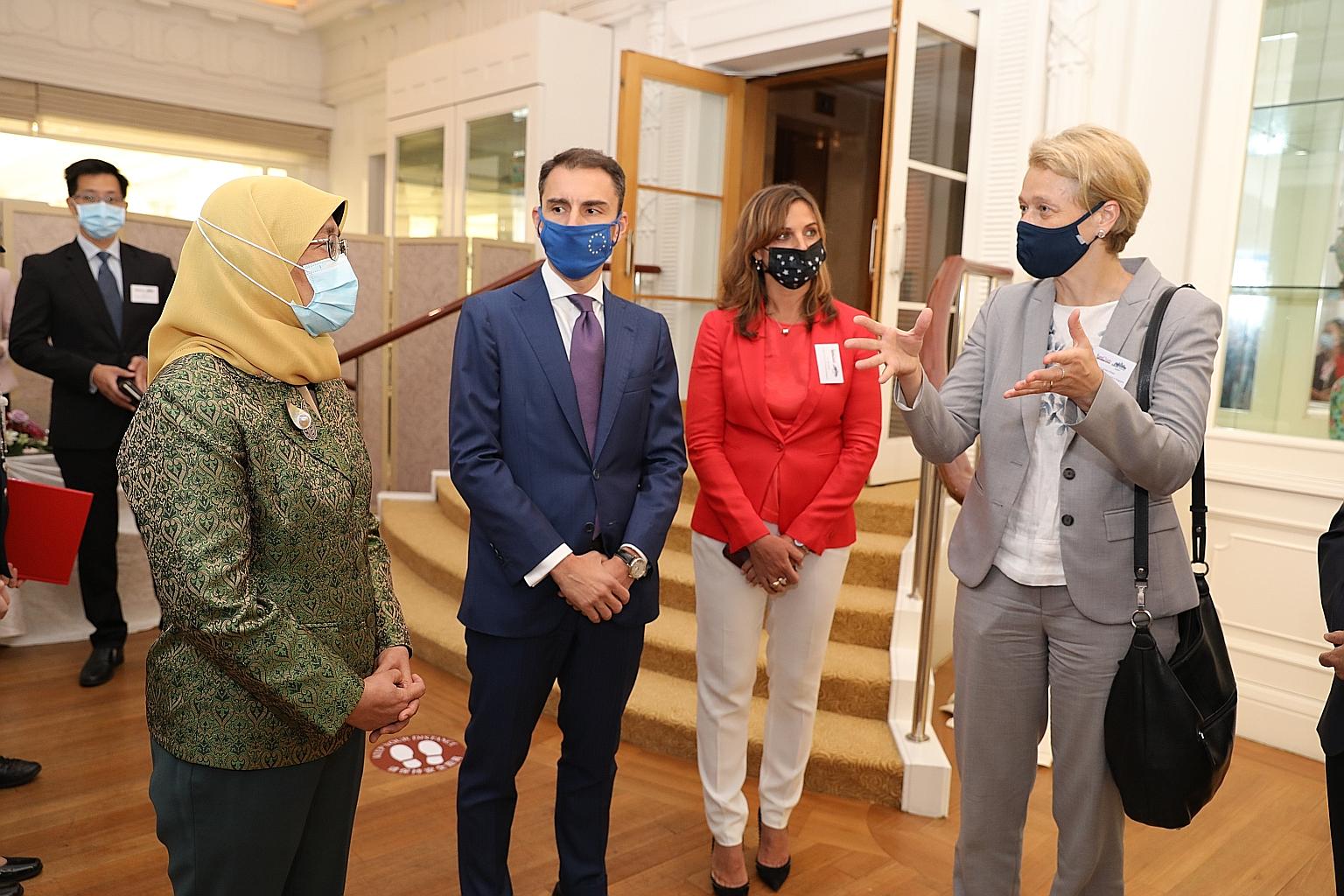 President Halimah Yacob with (from left) European Chamber of Commerce Singapore's president Federico Donato and executive director Nele Cornelis, and European Union Ambassador to Singapore Barbara Plinkert during the Europe Business Summit at Fullert