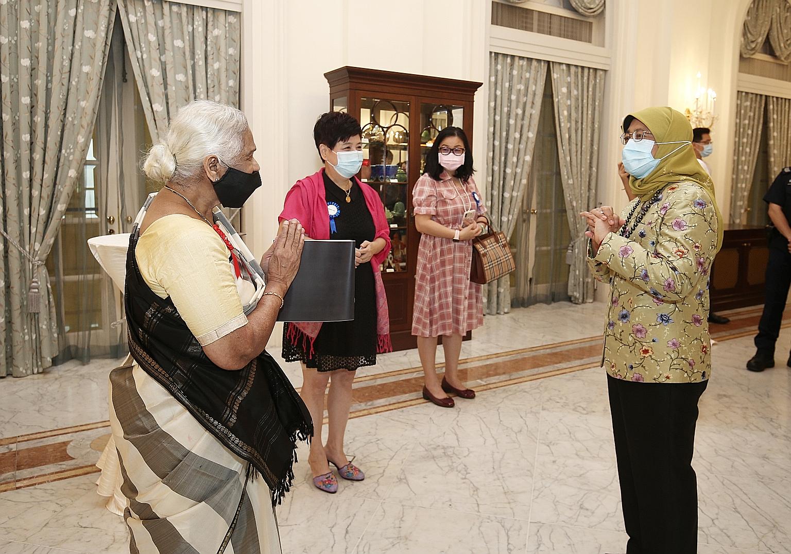 Pioneering dancer and choreographer Santha Bhaskar, 81, with President Halimah Yacob at the Istana on Monday. Mrs Bhaskar was inducted into the Singapore Women's Hall of Fame along with six other women, who were honoured posthumously.