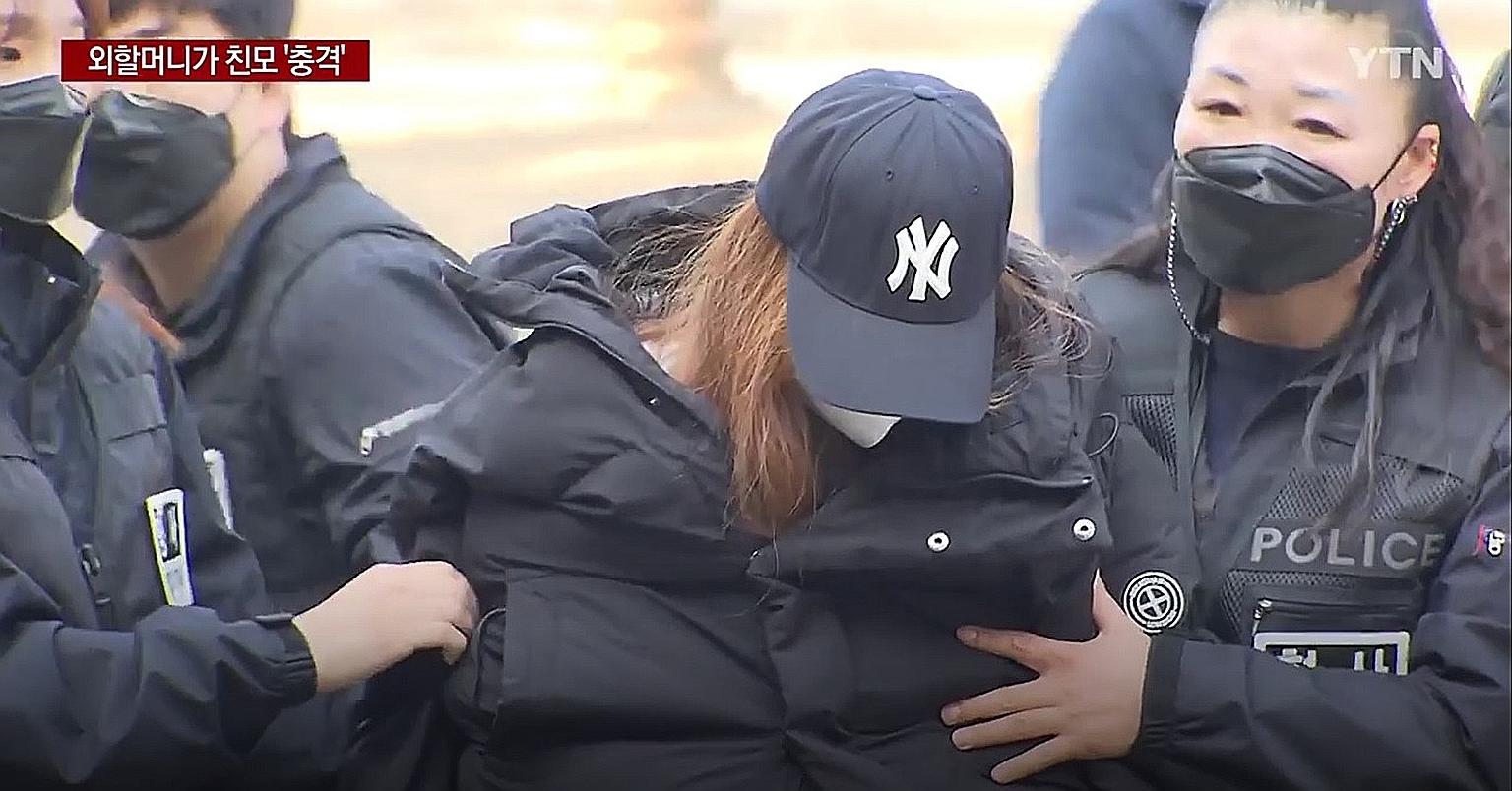 A 49-year-old woman being escorted to Daegu District Court last Thursday for investigations in relation to the death of a three-year-old girl in Gumi city. She was earlier believed to be the grandmother of the child, but DNA results have revealed tha