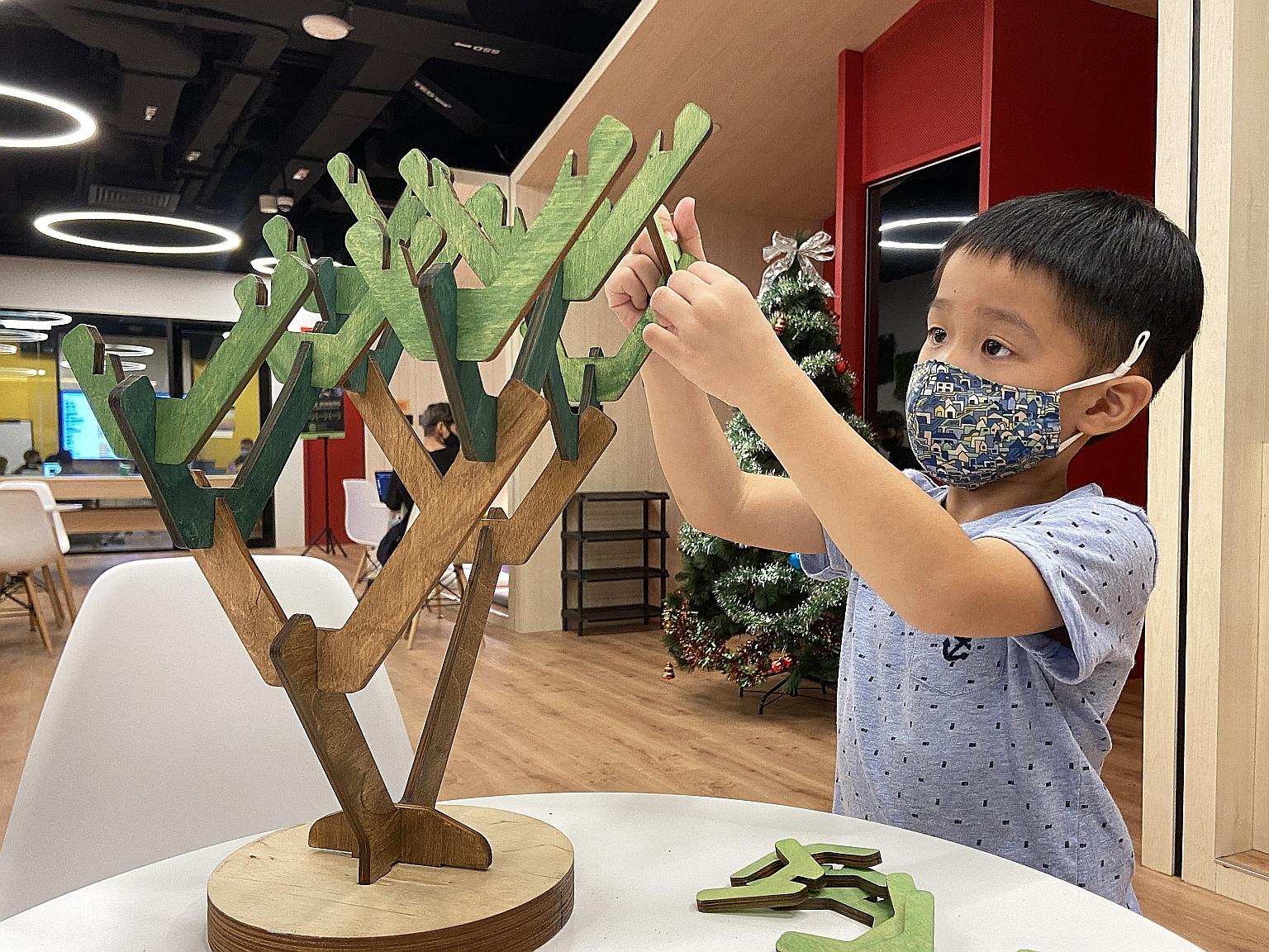 A child learning about the binary tree in computer science through the Learning At Home Set by Learning Beautiful coding play kit. A binary tree in computer science is a type of data structure in which each node has at most two branches.