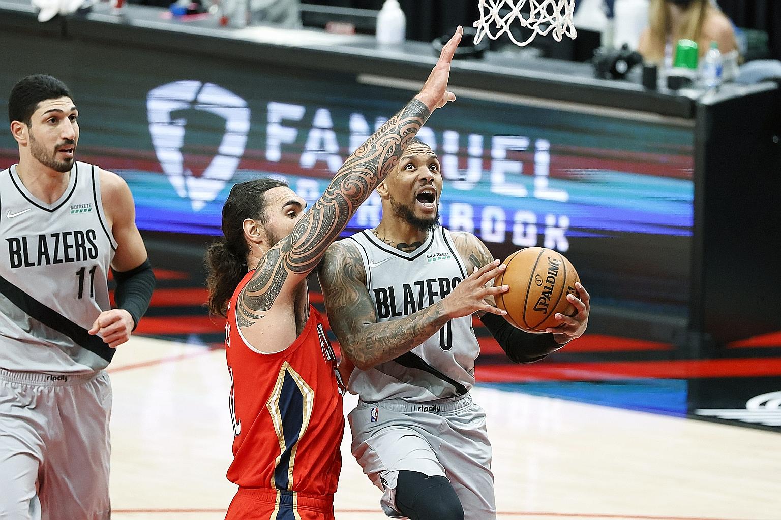 Portland guard Damian Lillard on the way to notching the 12th 50-point game of his career against the Pelicans on Tuesday. He had 20 points in the final quarter.