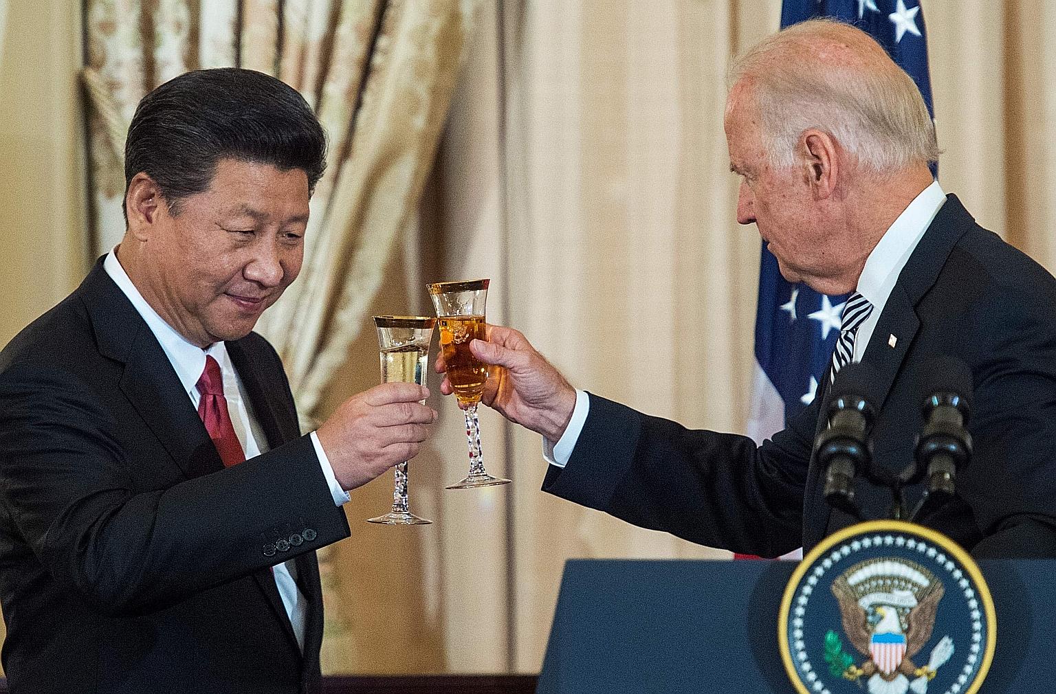 A 2015 file photo showing Chinese President Xi Jinping and then US Vice-President Joe Biden at a state luncheon in Washington. Chinese officials envision a Biden-Xi meeting organised around Earth Day on April 22 to show that both leaders are focused
