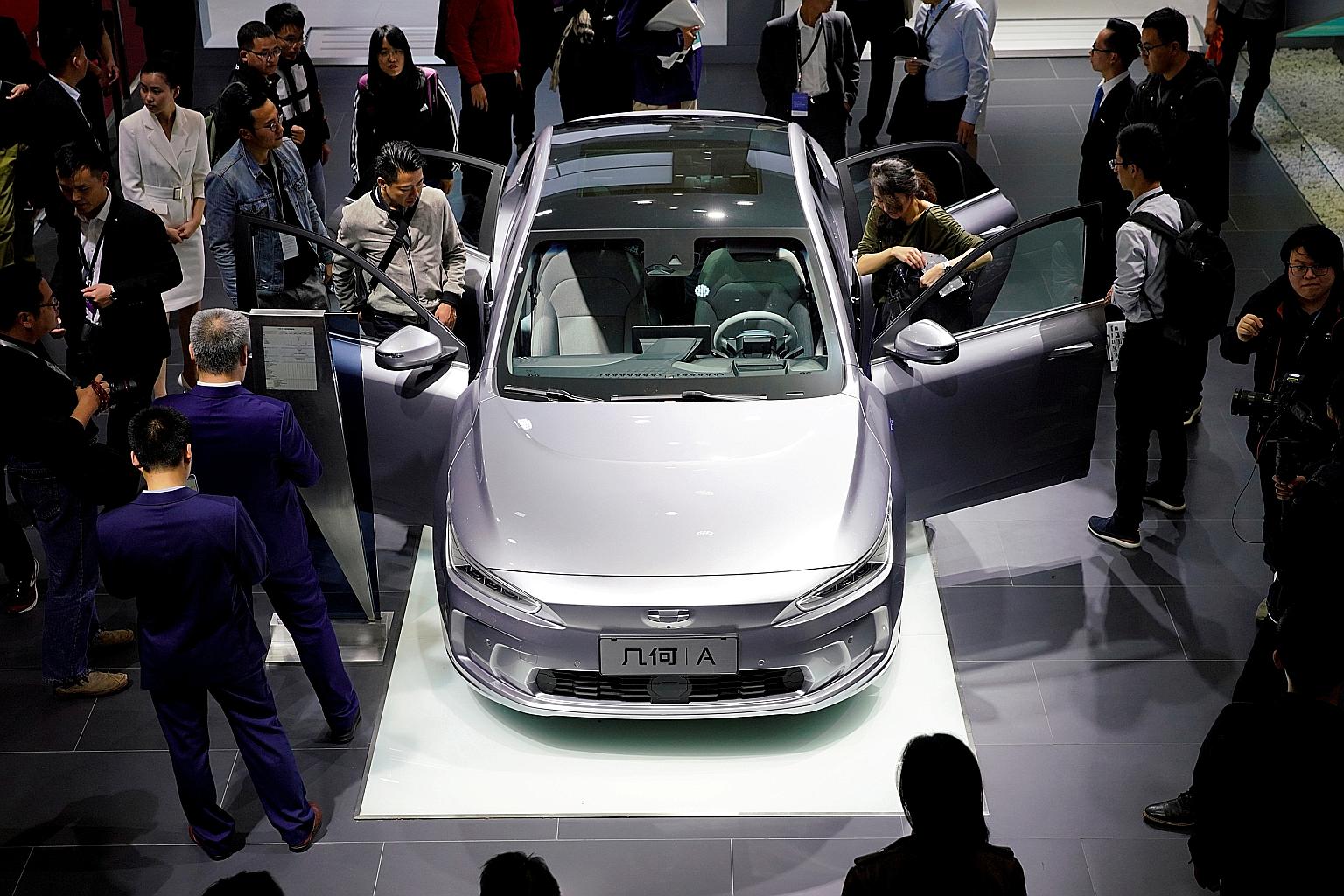 Geely's electric vehicle - the Geometry A (GE11) - at the Shanghai Auto Show in 2019. Geely, the owner of Volvo Cars, looks to take on its main EV rival Tesla with higher-end vehicles. PHOTO: REUTERS