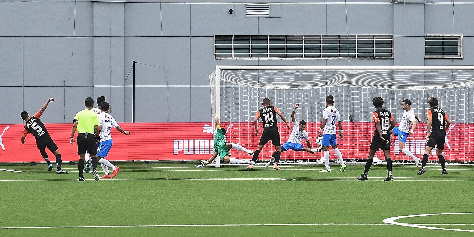 Lionel Tan (far left) rejoicing after opening accounts for Hougang against Lion City yesterday. Their 3-1 win over the Singapore Premier League favourites signals they could have an outside chance in the title race. ST PHOTO: KHALID BABA