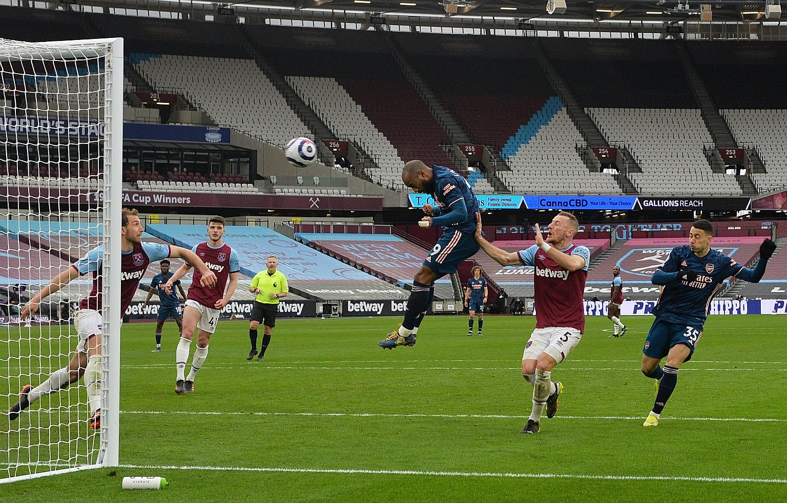 Alexandre Lacazette heading in Arsenal's equaliser at the London Stadium to save their blushes after having trailed by three goals.