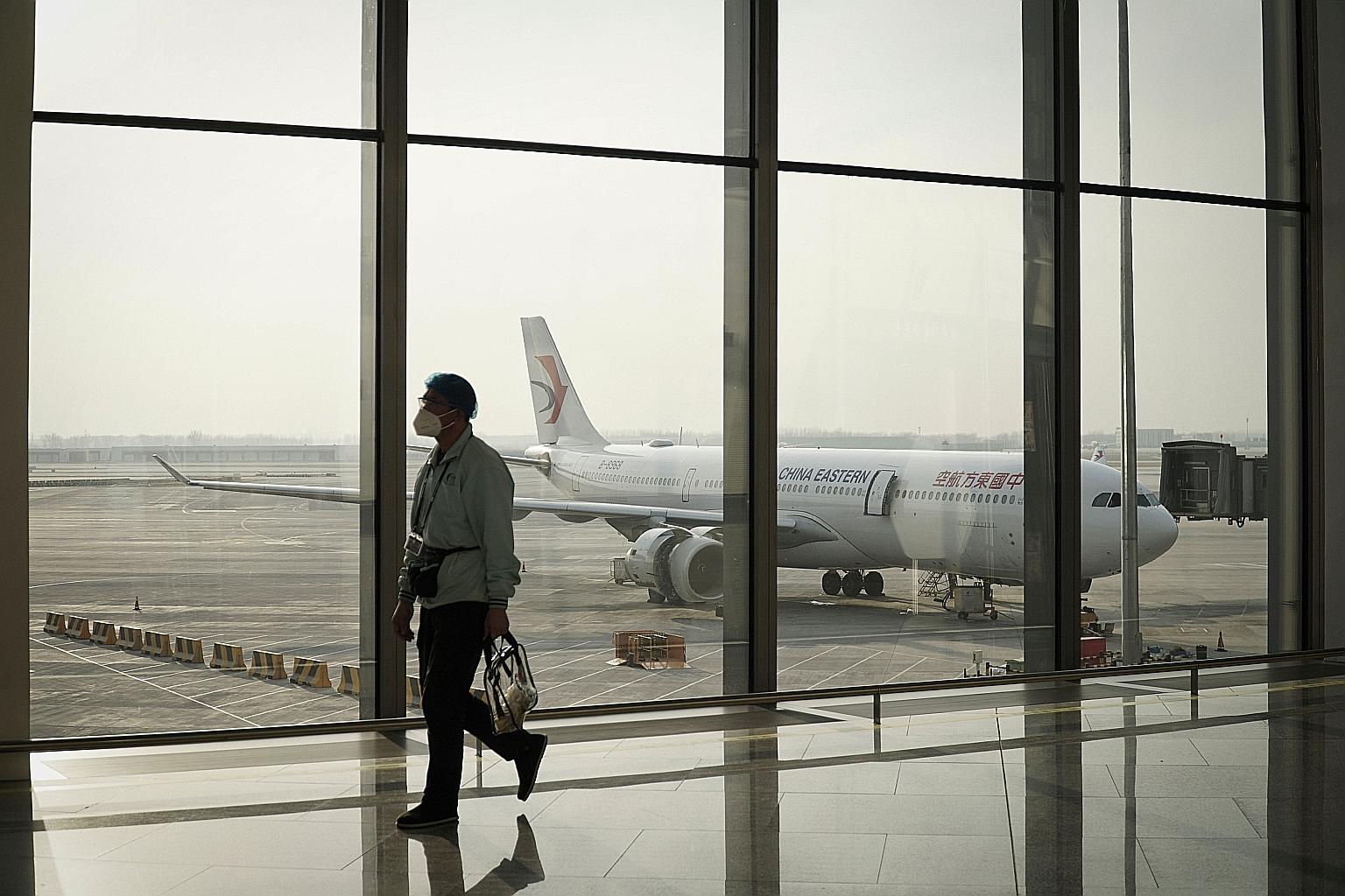 Daxing International Airport in Beijing. To stop the coronavirus, China bans tourists and short-term business travellers outright, and it sets tough standards for all other foreigners, even those who have lived there for years. The restrictions have