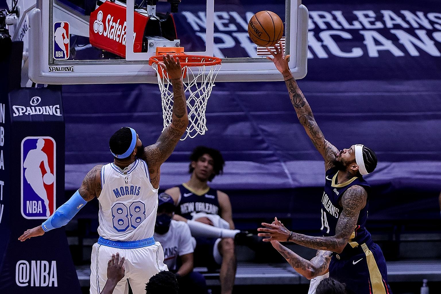 New Orleans Pelicans forward Brandon Ingram shooting a lay-up against Los Angeles Lakers forward Markieff Morris during the first half at Smoothie King Centre. The Pelicans beat the NBA champions 128-111.