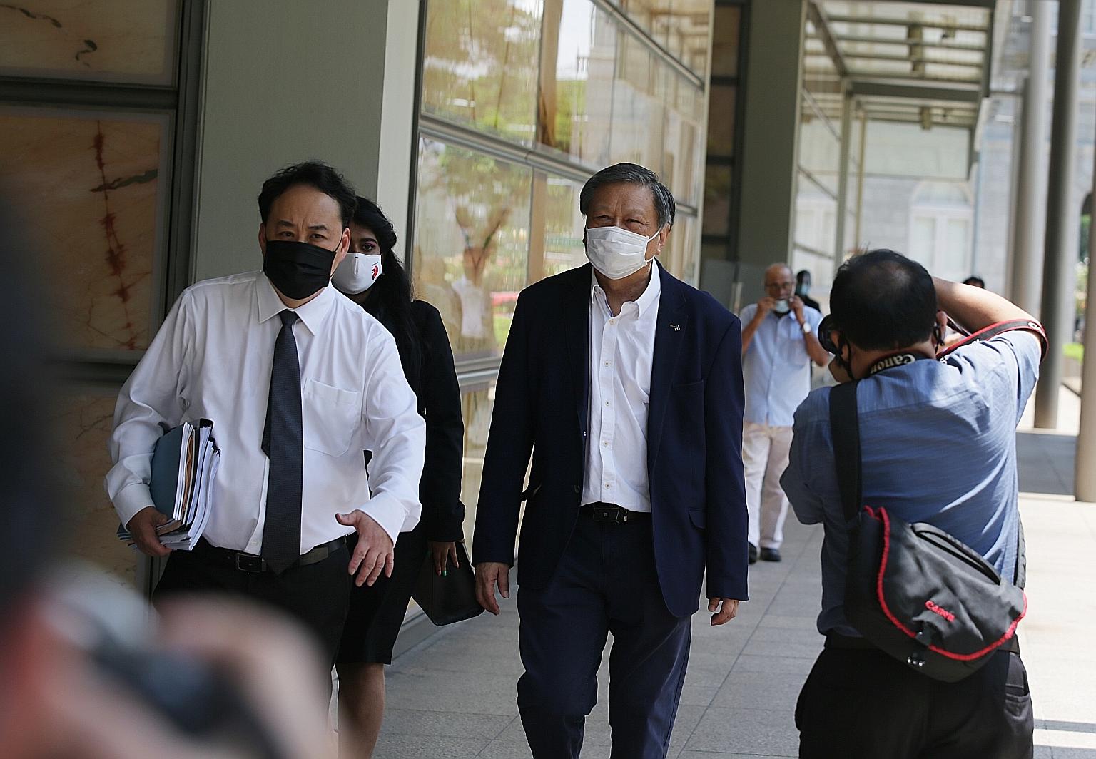 Mr Leong Sze Hian (centre) was sued for sharing on Facebook an article from a Malaysian news site that falsely linked Prime Minister Lee Hsien Loong to the 1Malaysia Development Berhad corruption scandal. ST PHOTO: KELVIN CHNG