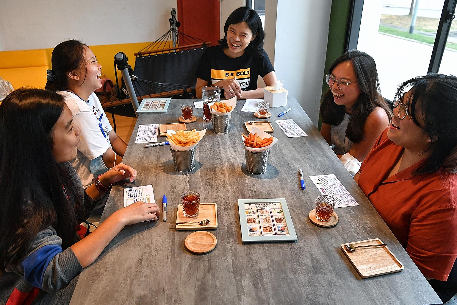 Ms Yong Yoek Ling (centre), founder of Bold At Work, which is involved in organising a pop-up conversation bar that gets participants to select and explore themes on mental wellness.