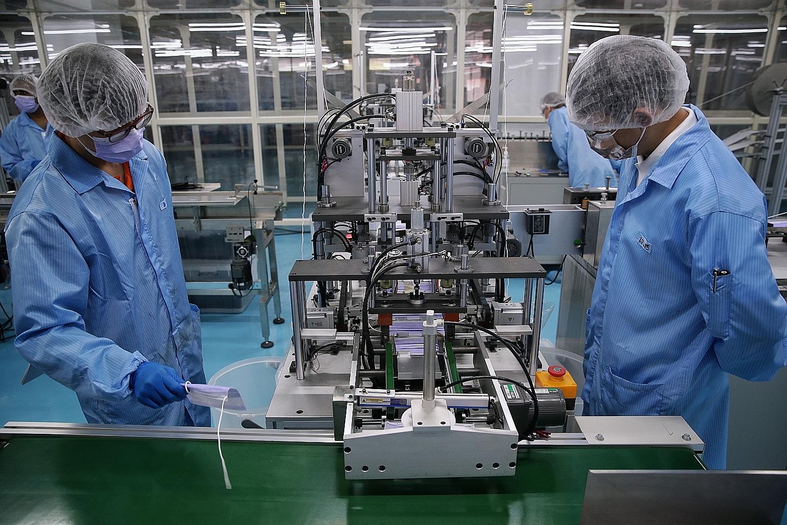 A mask factory in Singapore. Biomedical manufacturing rose 23.9 per cent year on year last month, as pharmaceuticals output grew 16.7 per cent, while the medical technology segment expanded 12.6 per cent, with higher export demand for medical devices