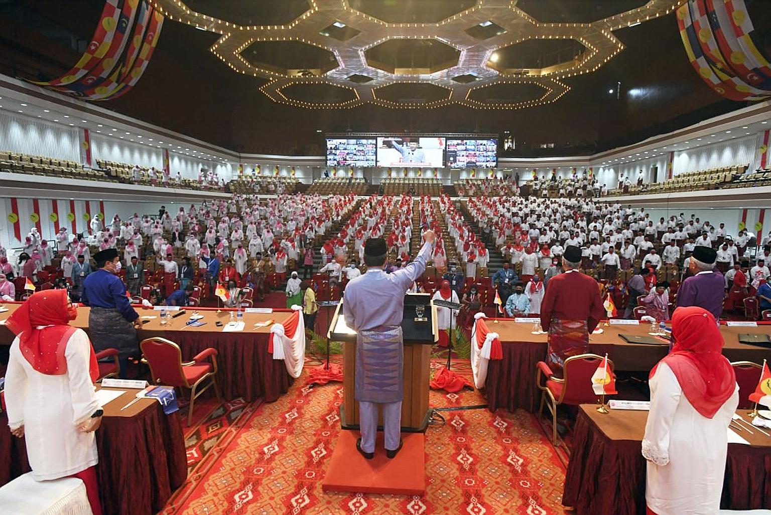 Umno deputy president Mohamad Hasan (centre) speaking at the opening of the meetings by the youth, women's and young women's wings at the Putra World Trade Centre in Kuala Lumpur yesterday. He dismissed claims that Muslims were split, saying cooperat