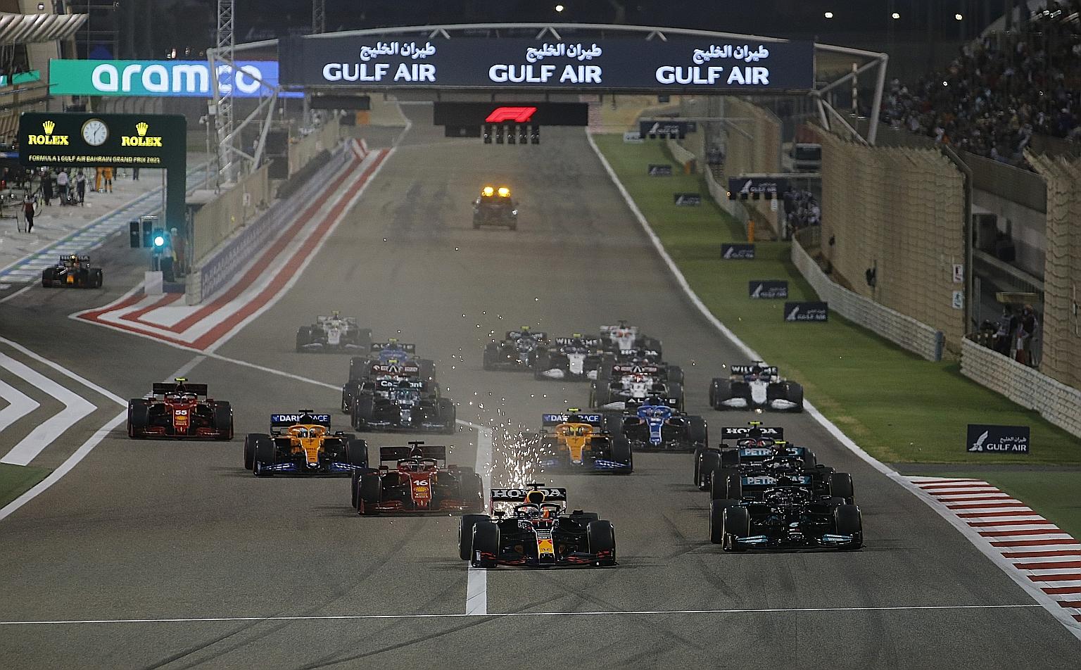 Red Bull's pole-sitter Max Verstappen leading at the start of the Formula One season-opening Bahrain Grand Prix yesterday. The Dutchman finished second - 0.745 of a second behind defending world champion Lewis Hamilton of Mercedes, who hung on for vi