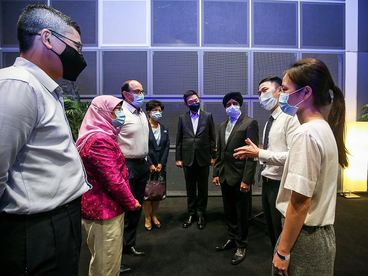 President Halimah Yacob and Minister for Communications and Information S. Iswaran yesterday at the Infocomm Media Development Authority's Partners' Appreciation event to recognise those who contributed to digital inclusion and readiness efforts here