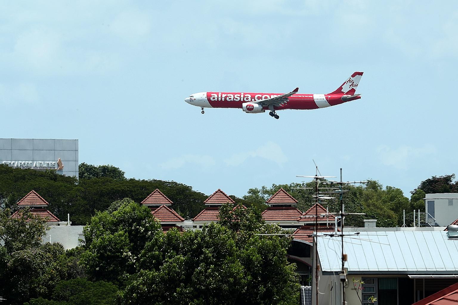 AirAsia Group reported a 90 per cent fall in passengers compared to a year ago, resulting in load factor, a measure of how full planes are, dropping 15 percentage points to 67 per cent. ST PHOTO: BENJAMIN SEETOR