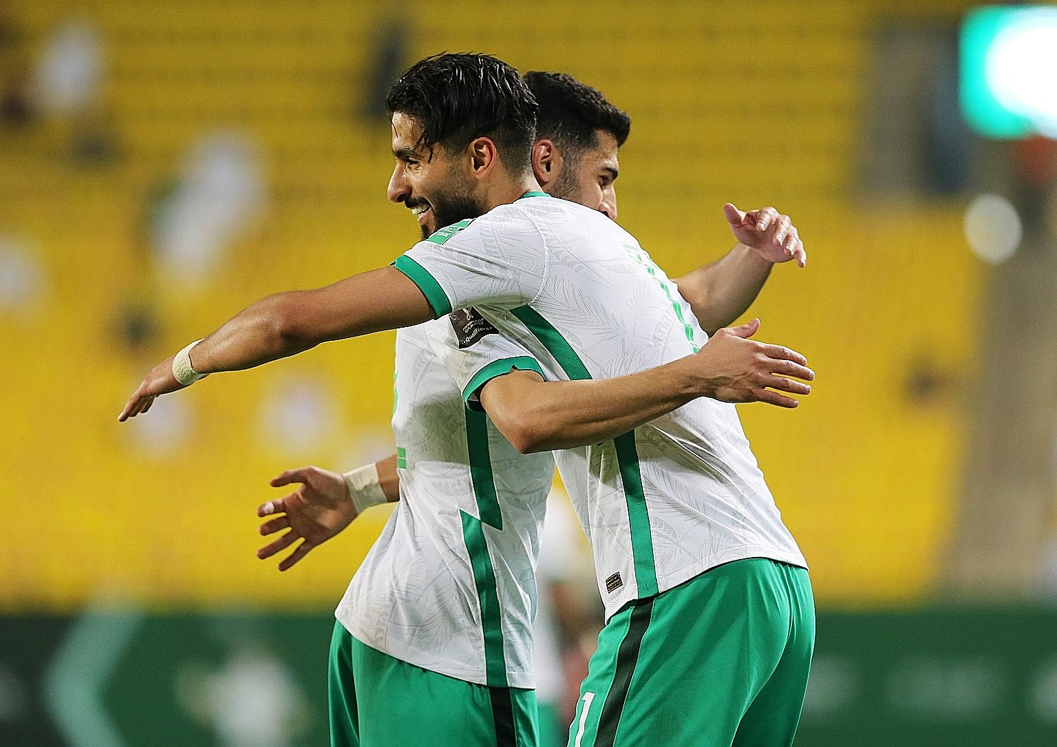 A happy Saleh Al-Shehri after scoring Saudi Arabia's third goal against Palestine in their World Cup qualifier. They won 5-0 and lead Uzbekistan by two points and Singapore by four.