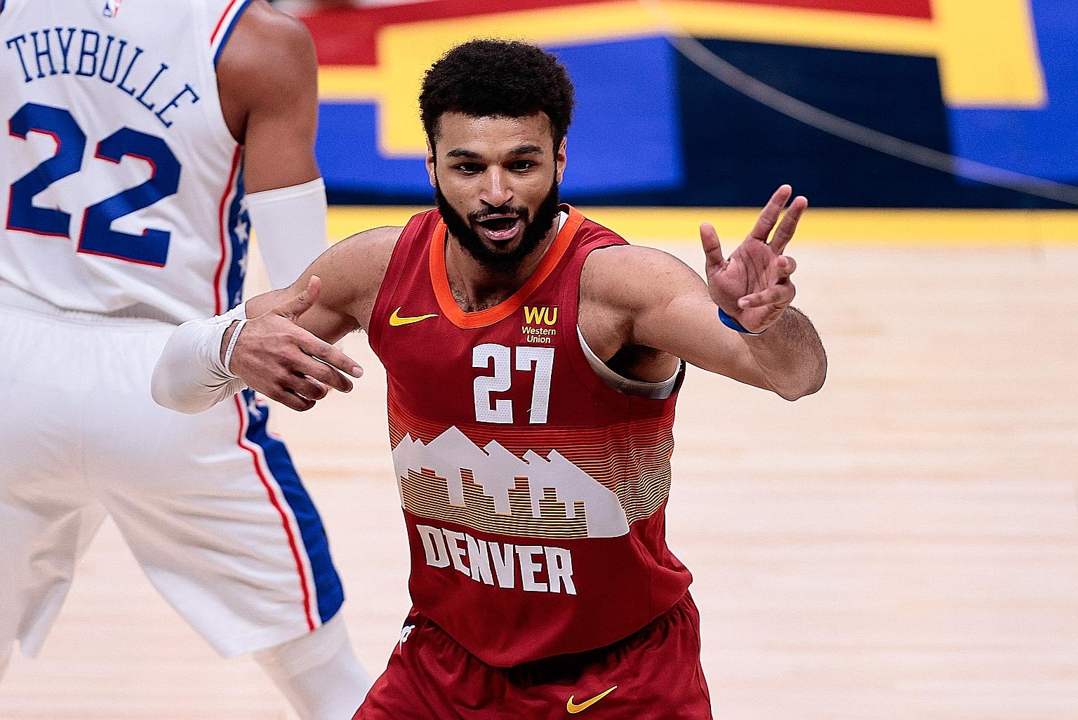 Denver guard Jamal Murray is delighted after a play against Philadelphia in their 104-95 win at home. PHOTO: REUTERS