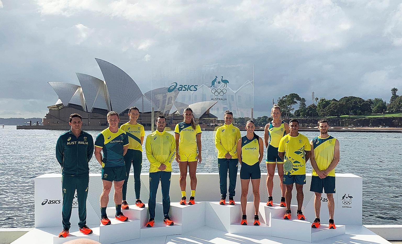 Australian Olympians in front of the Sydney Opera House at the unveiling of the team uniforms for the Tokyo Olympics yesterday. PHOTO: REUTERS