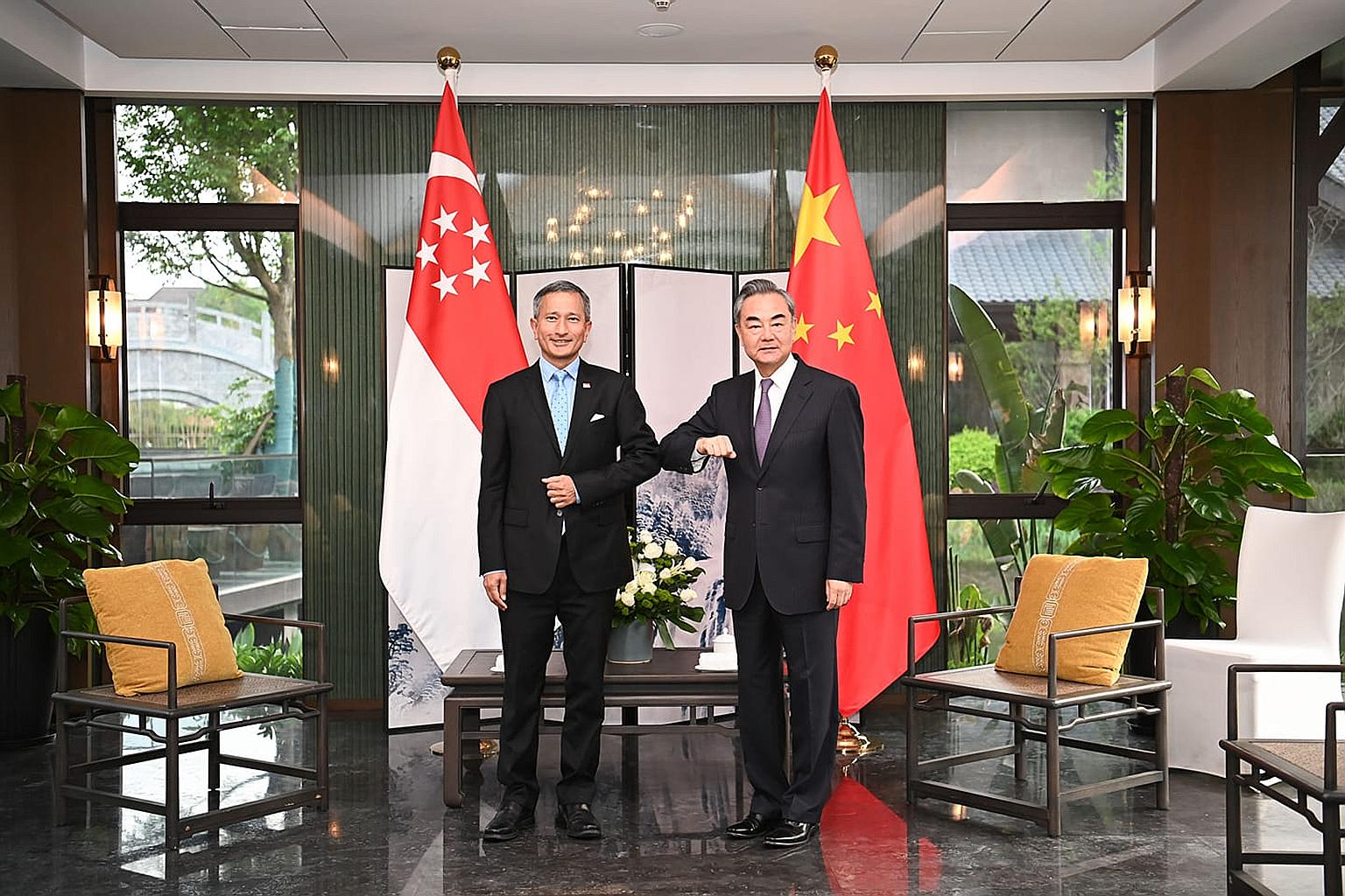 China's State Councillor and Foreign Minister Wang Yi welcoming Dr Vivian Balakrishnan to Fujian yesterday. PHOTO: WANG WENBIN/FACEBOOK