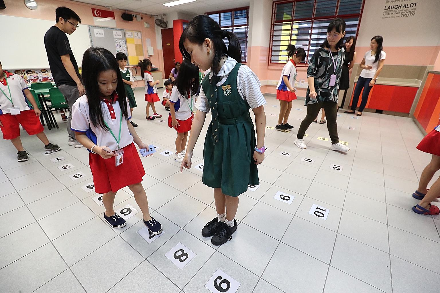 A Primary 1 Open House event at Juying Primary School in 2018. The school will be merged with Pioneer Primary next year and will be relocated to a new site in the Plantation District in Tengah from January 2025. LIANHE ZAOBAO FILE PHOTO