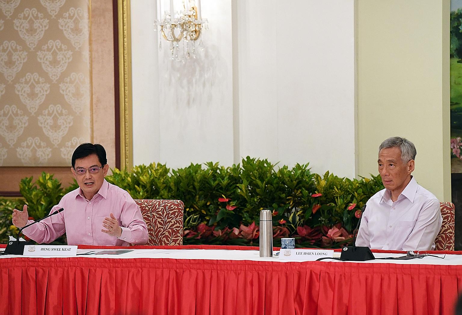 Deputy Prime Minister Heng Swee Keat and Prime Minister Lee Hsien Loong at the news conference at the Istana yesterday. Mr Heng said he made the decision to step aside as leader of the 4G team with the best interests of Singapore at heart, and PM Lee