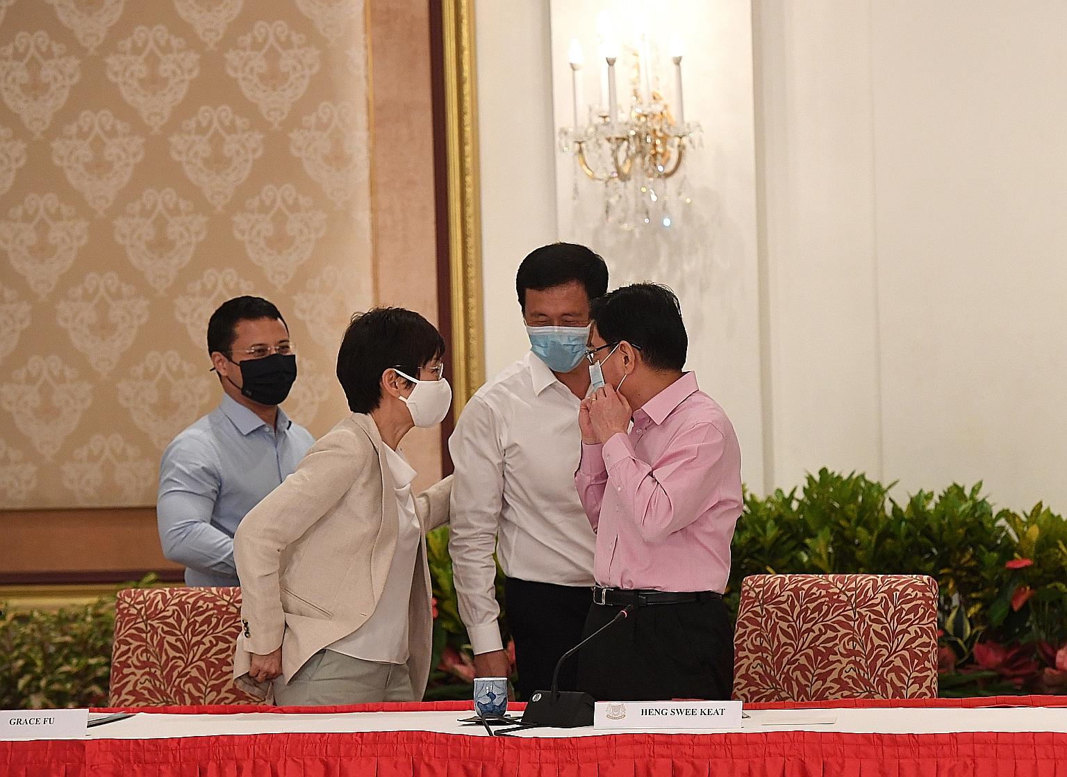 Deputy Prime Minister Heng Swee Keat with (from left) 4G ministers Desmond Lee, Grace Fu and Ong Ye Kung after the media conference on Thursday, where Mr Heng's decision to step aside as the leader of the 4G team was announced.