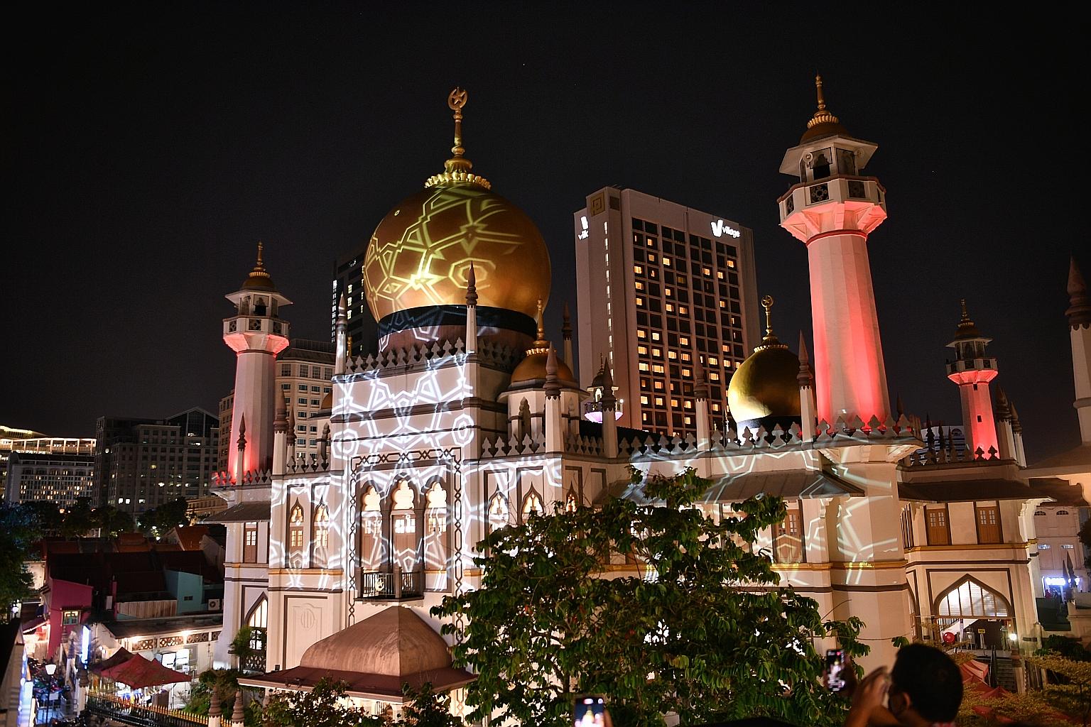 A light projection on Sultan Mosque yesterday. To mark the fasting month of Ramadan, evening light shows will project animation and motifs of the history and culture of Kampong Glam onto the facade of Sultan Mosque nightly until May 12. Several stree