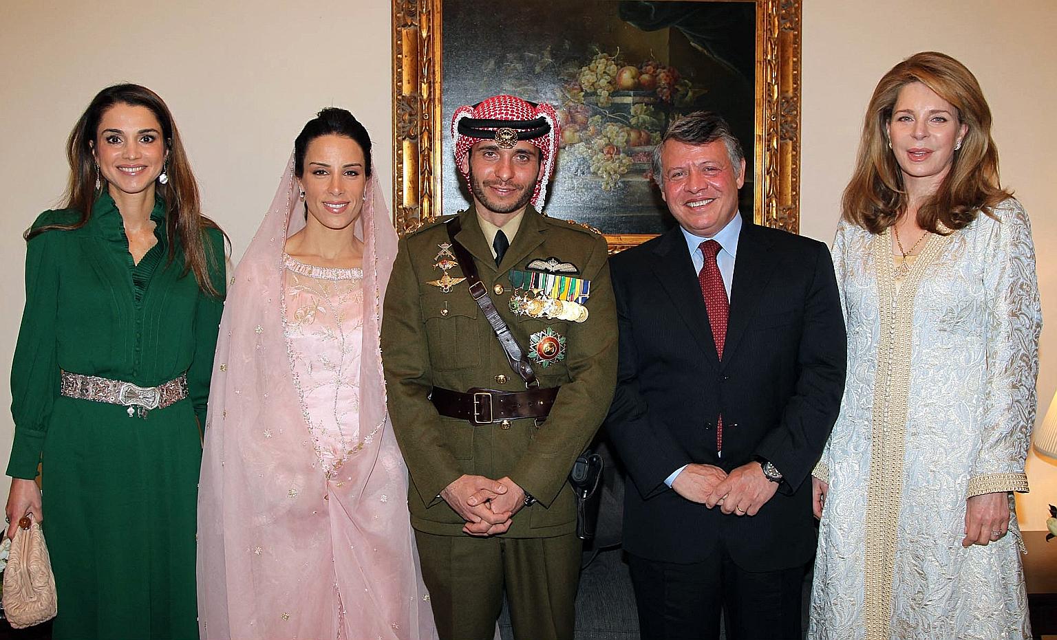 A 2012 photo of Jordan's Prince Hamzah (centre) and his wife, Princess Basma Otoum, beside him at their wedding ceremony in Amman. With them are King Abdullah II and Queen Rania (in green), as well as Queen Noor, widow of the late King Hussein. While