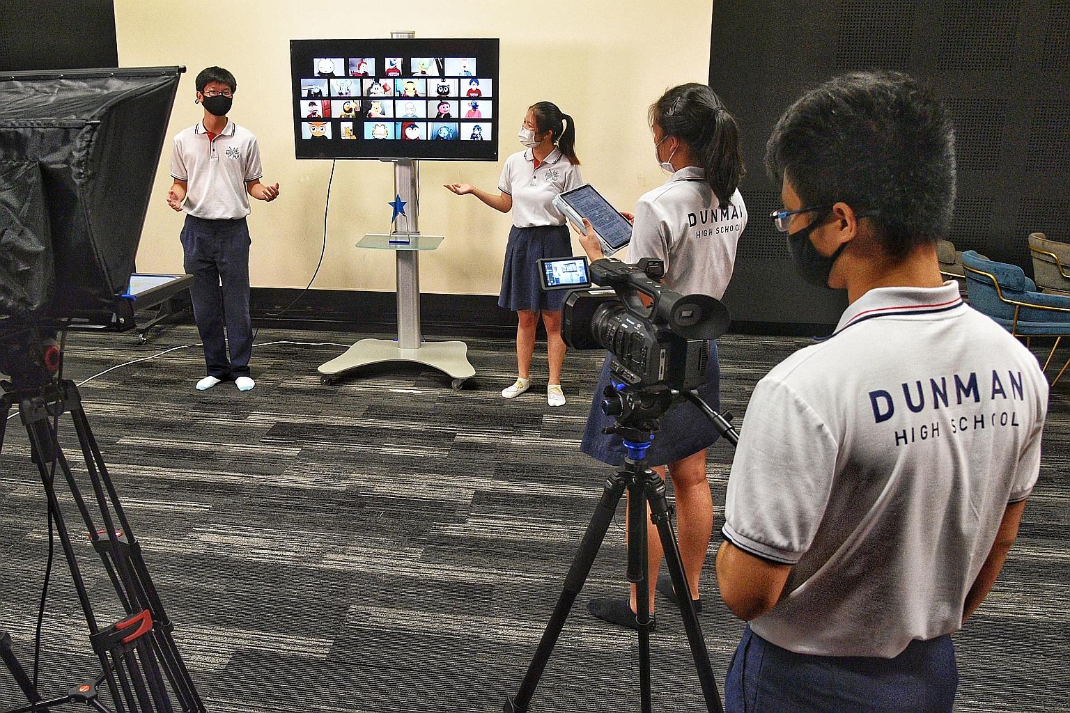 Students from Dunman High School's choir recording the finale for a virtual singing competition. Choir members take turns to come back for physical practices weekly based on a roster, while the rest tune in from home on Zoom. ST PHOTO: DESMOND WEE